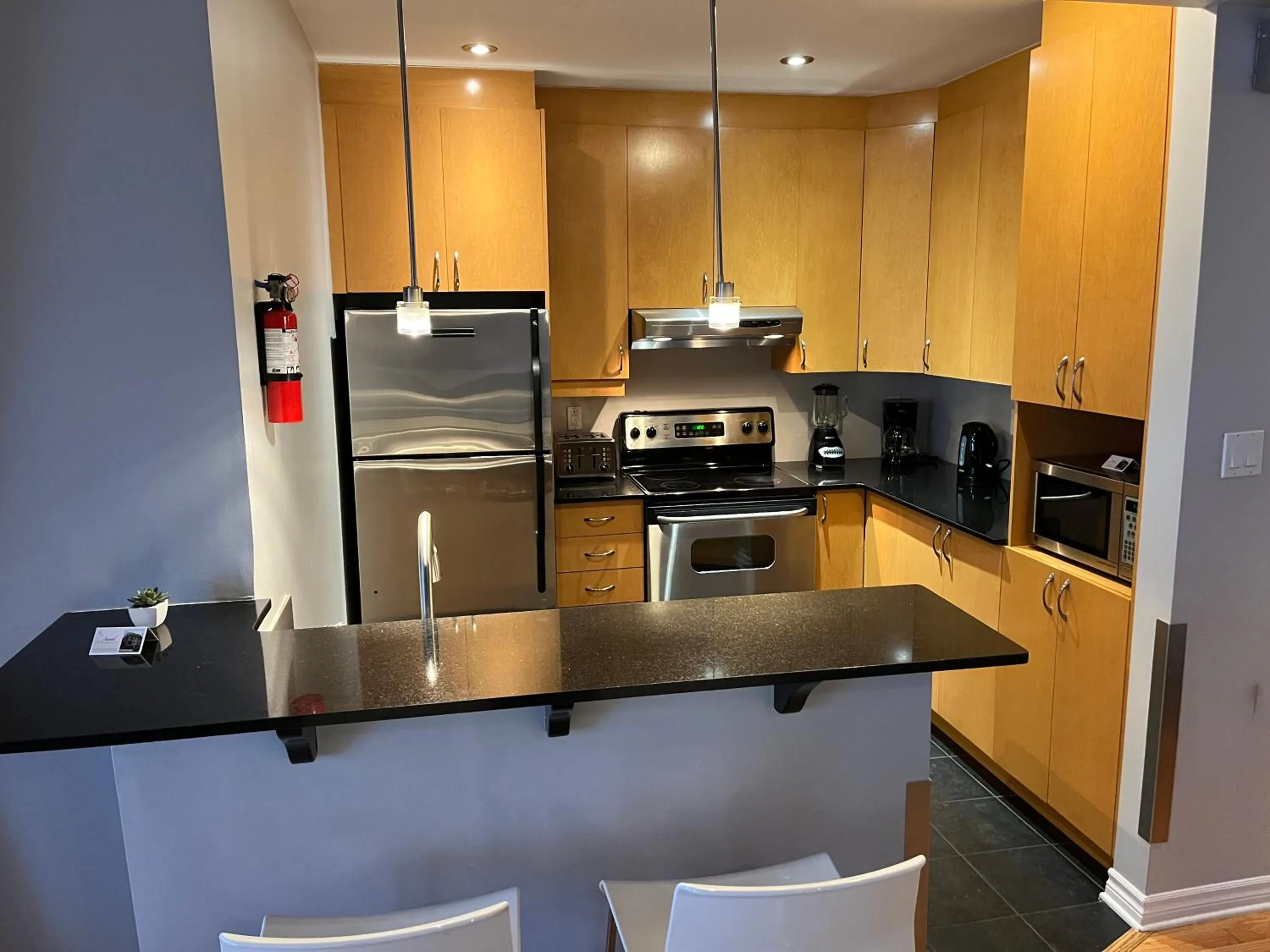 kitchen in ApartHotelMontreal by Les Terrasses Saint Urbain 2225I2