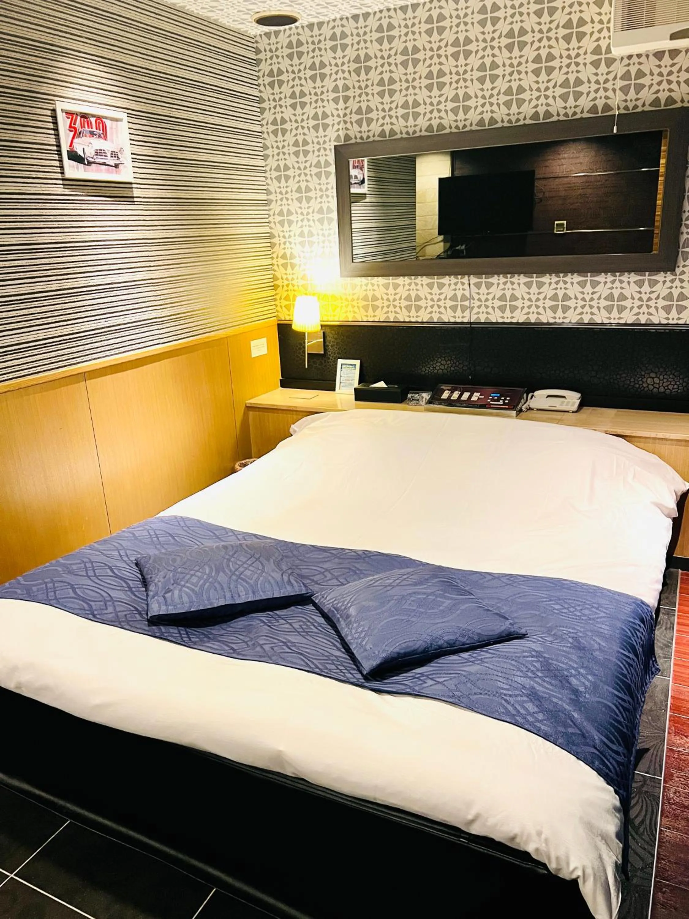 Bed in ホテル CROWN MOTEL
