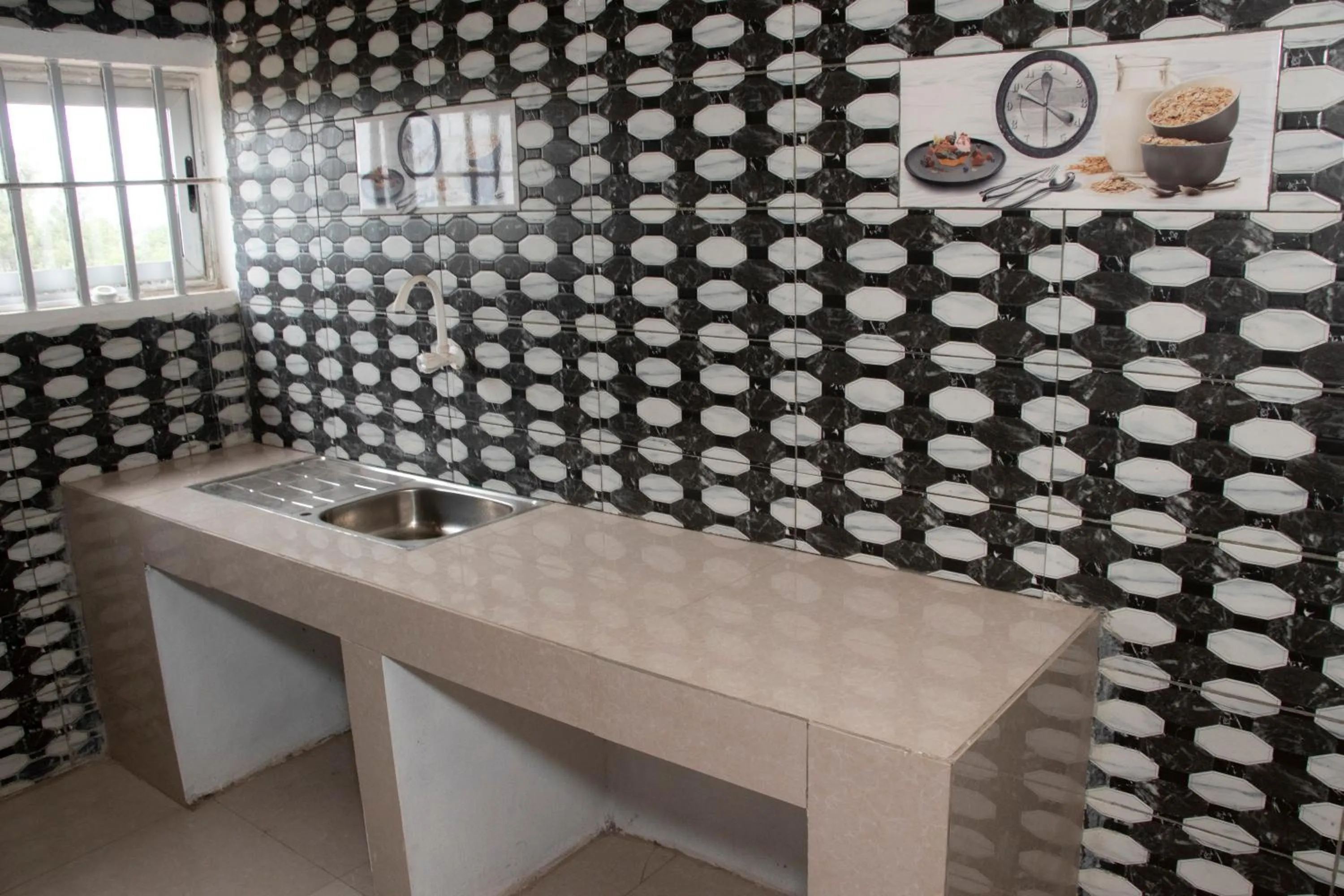 Kitchen or kitchenette in Alafia Hotel Ketou