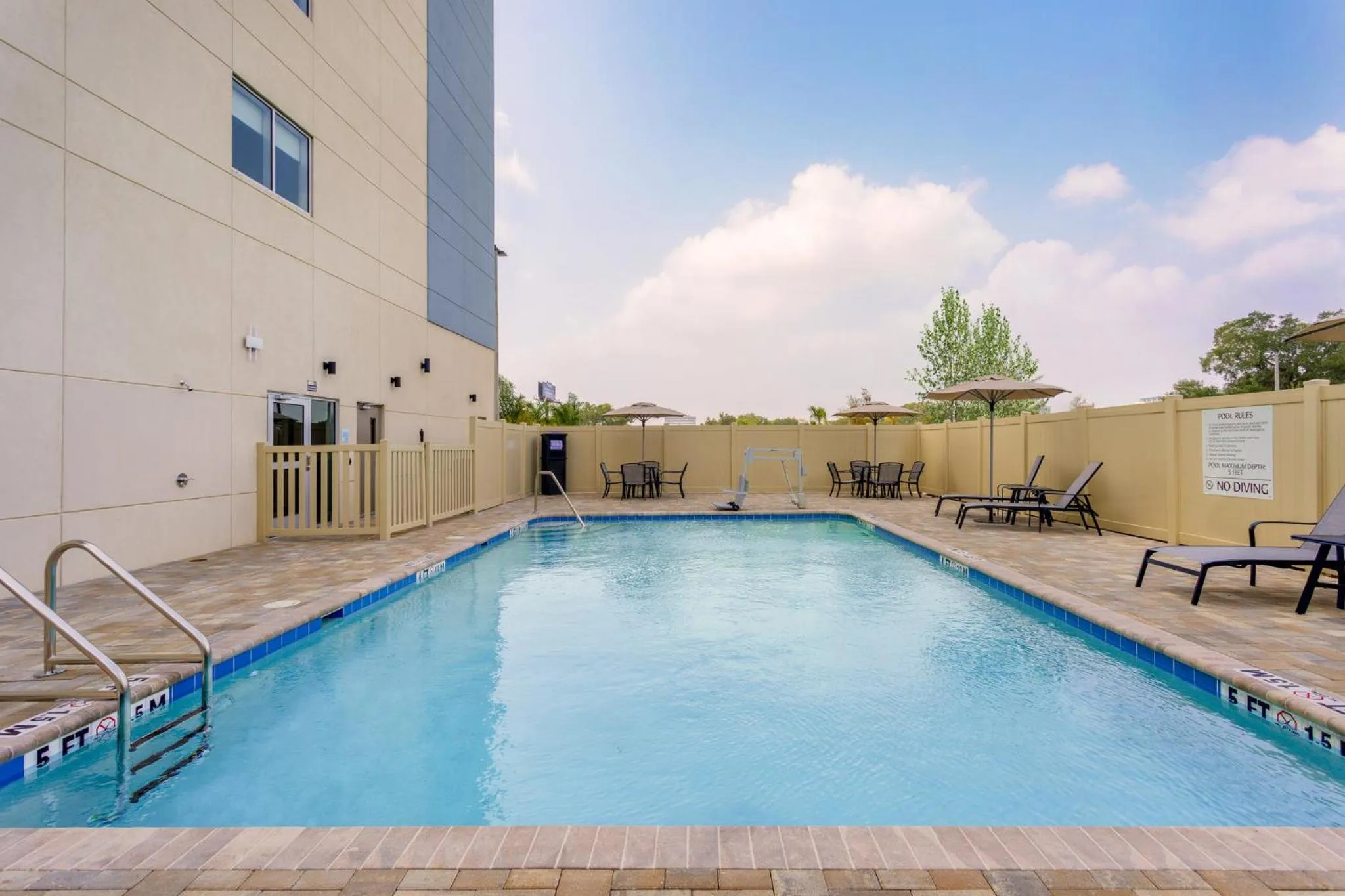 Swimming pool in Holiday Inn Express & Suites Tampa Stadium - Airport Area by IHG