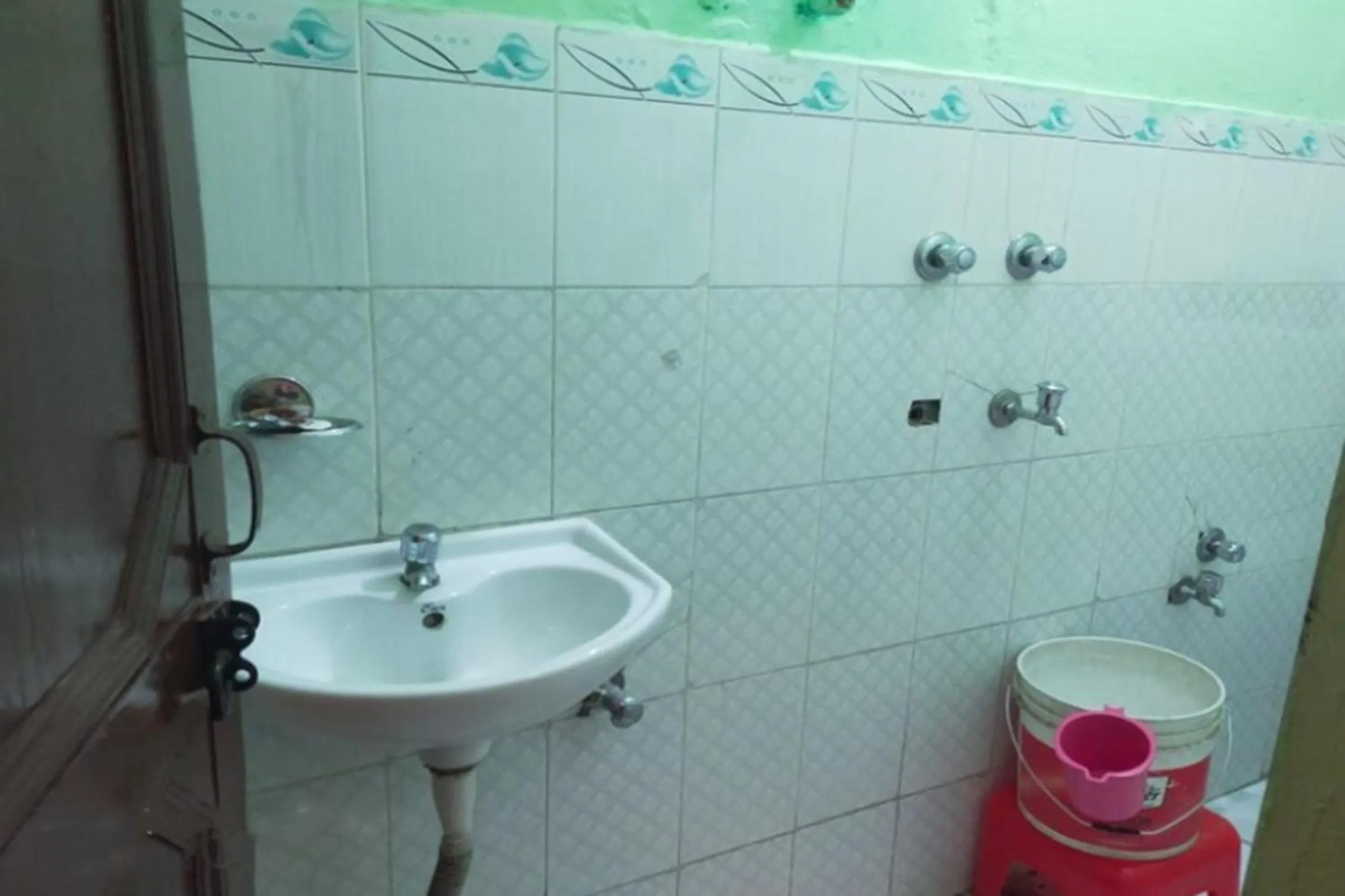 Bathroom in Mamta Palace by StayApart