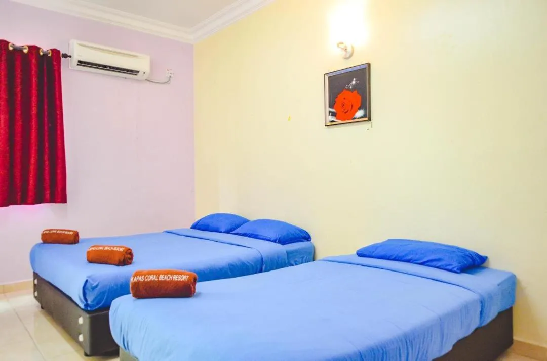 Bed in Kapas Coral Beach Resort