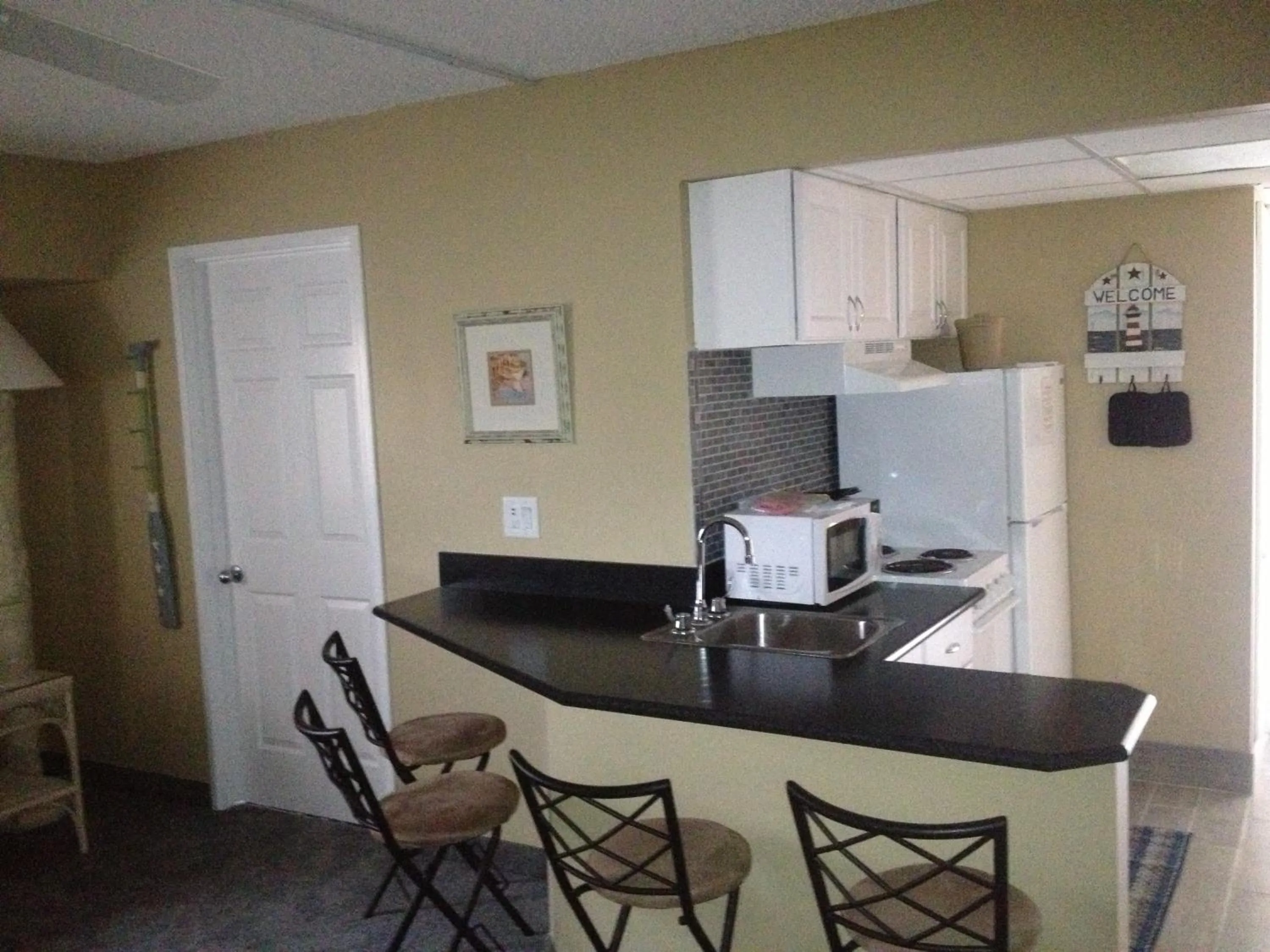 Kitchen or kitchenette in Biscayne Suites