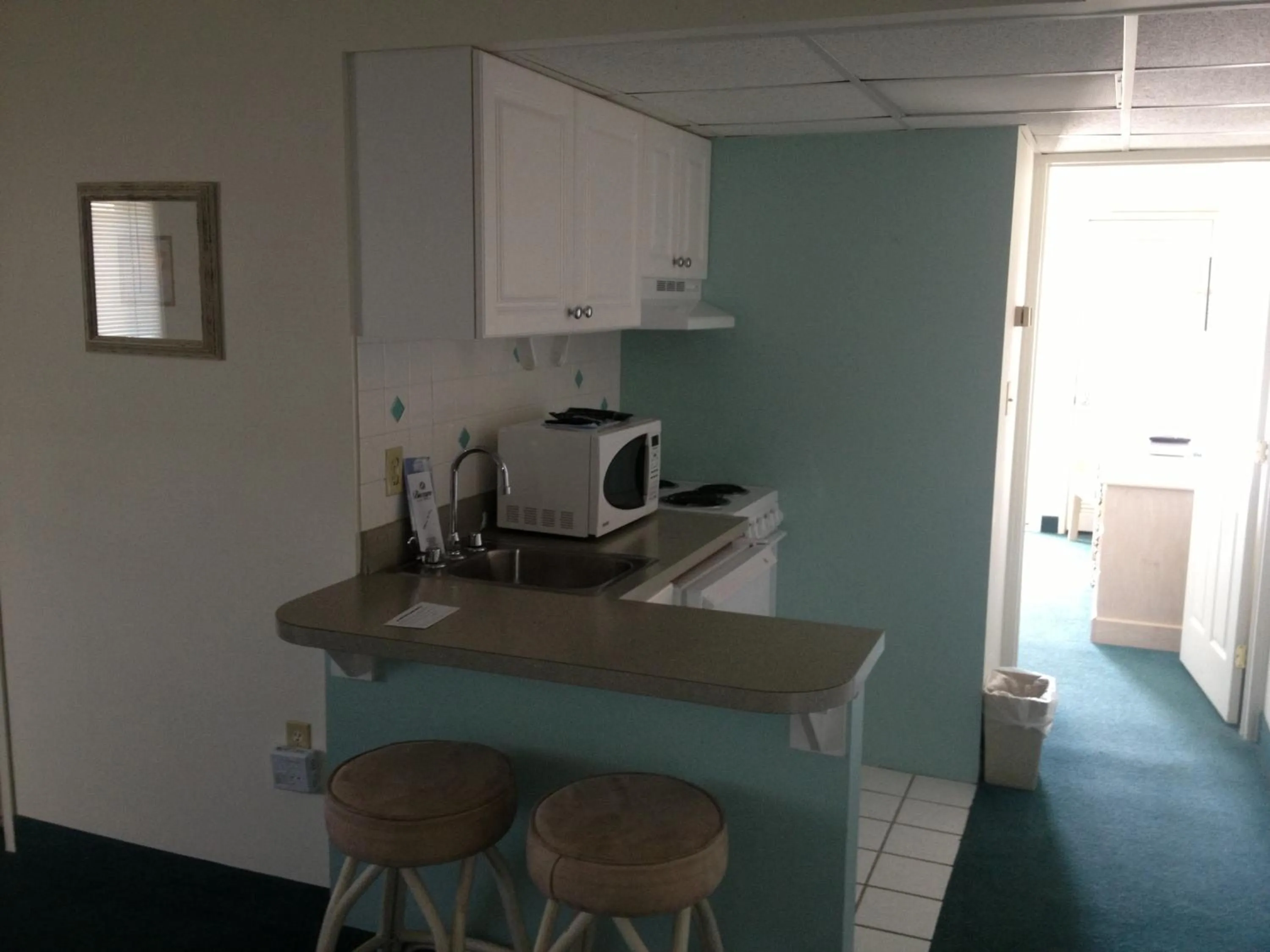 Kitchen or kitchenette in Biscayne Suites