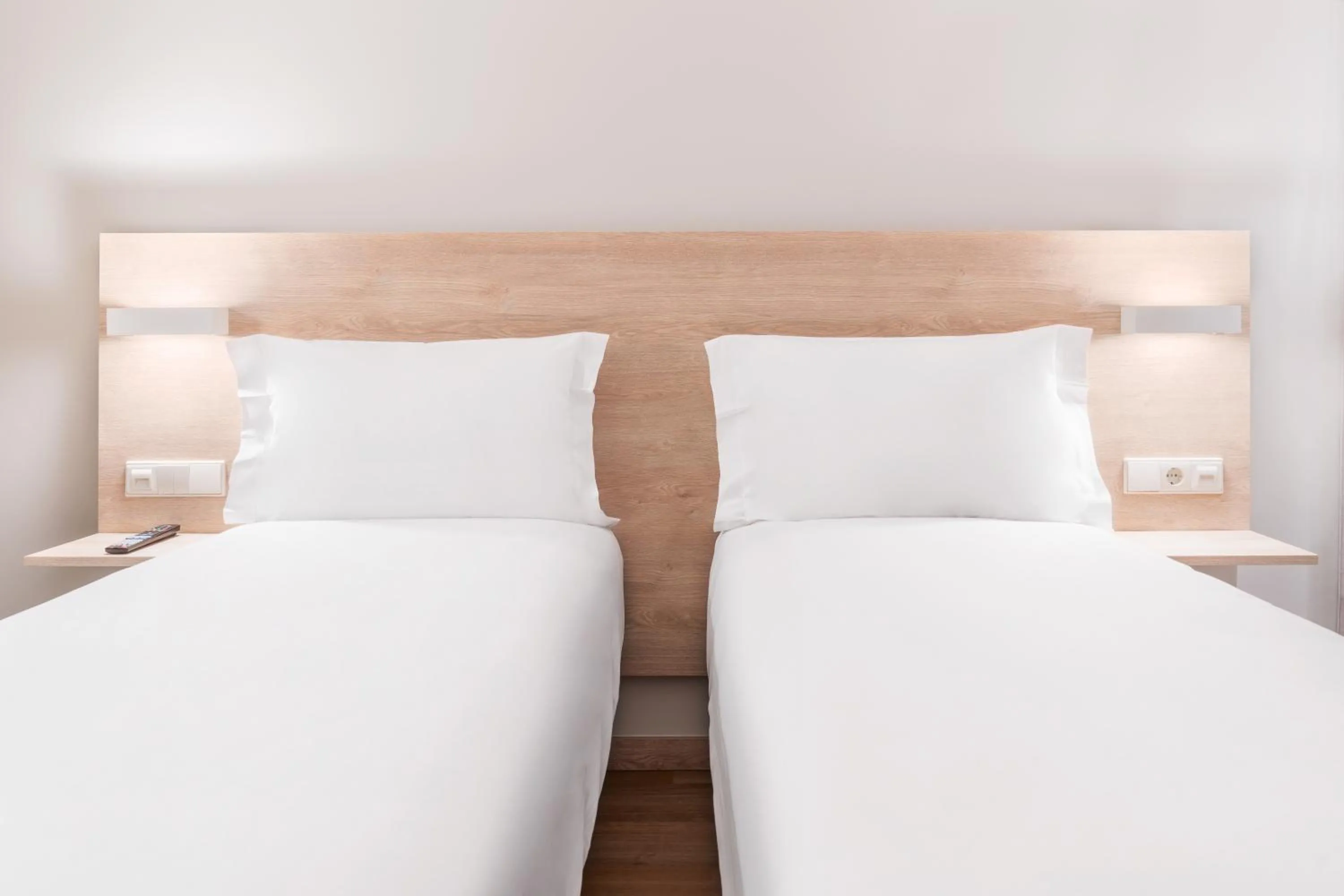 Bed in Moov Hotel Lisboa Oriente