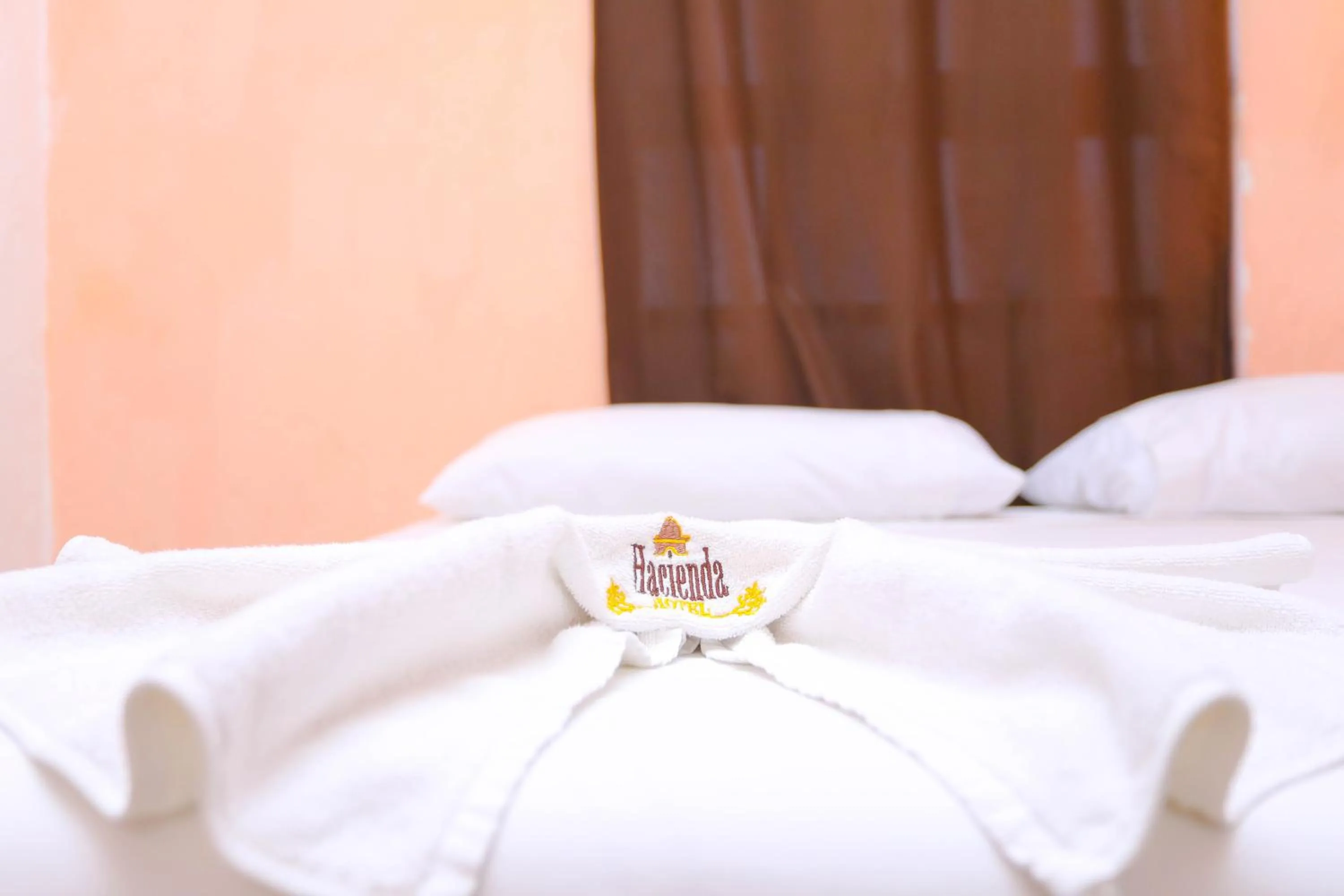 towels, Bed in Hotel Hacienda Cancun