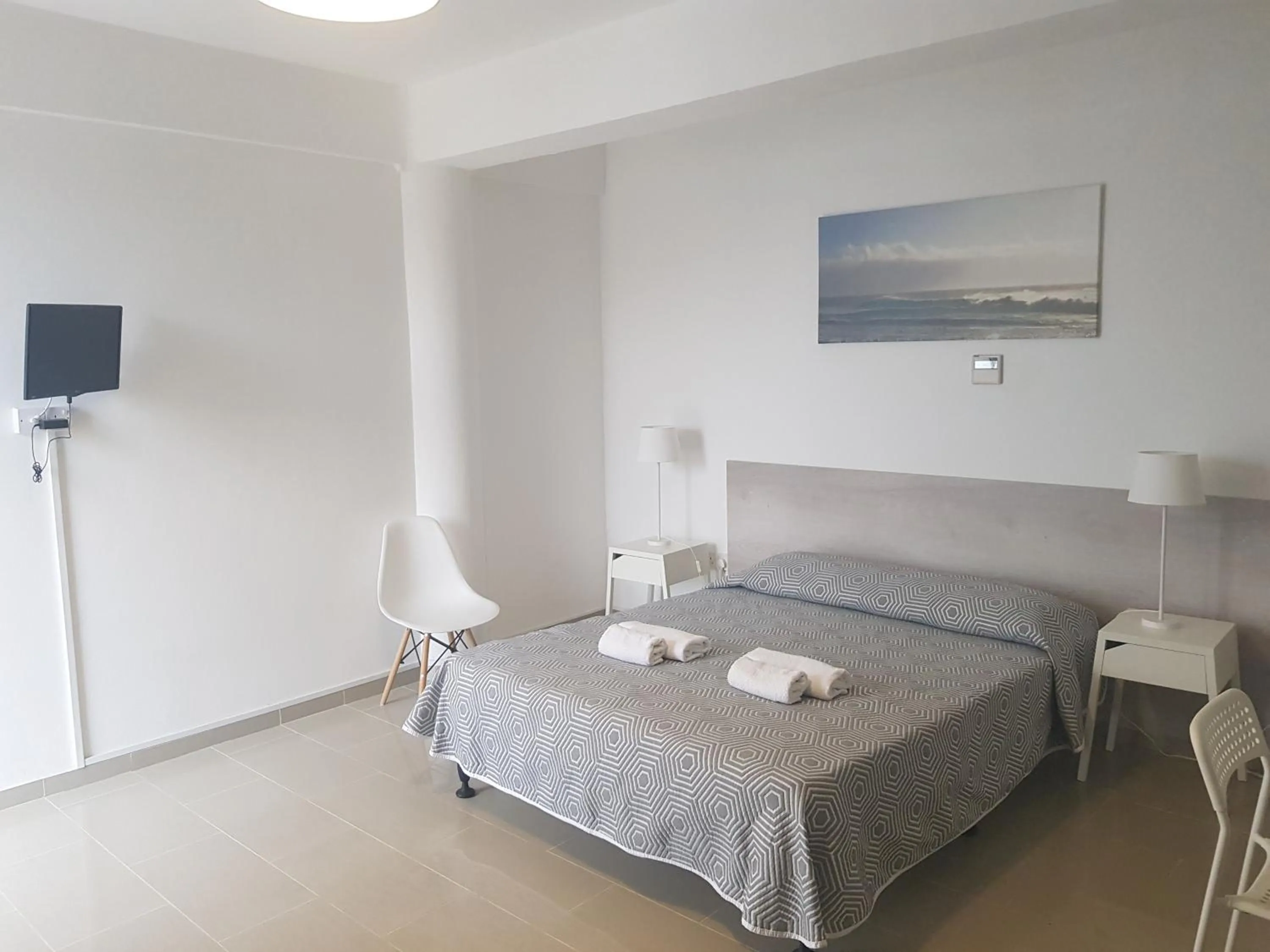 Bed in Valentinos Apartments