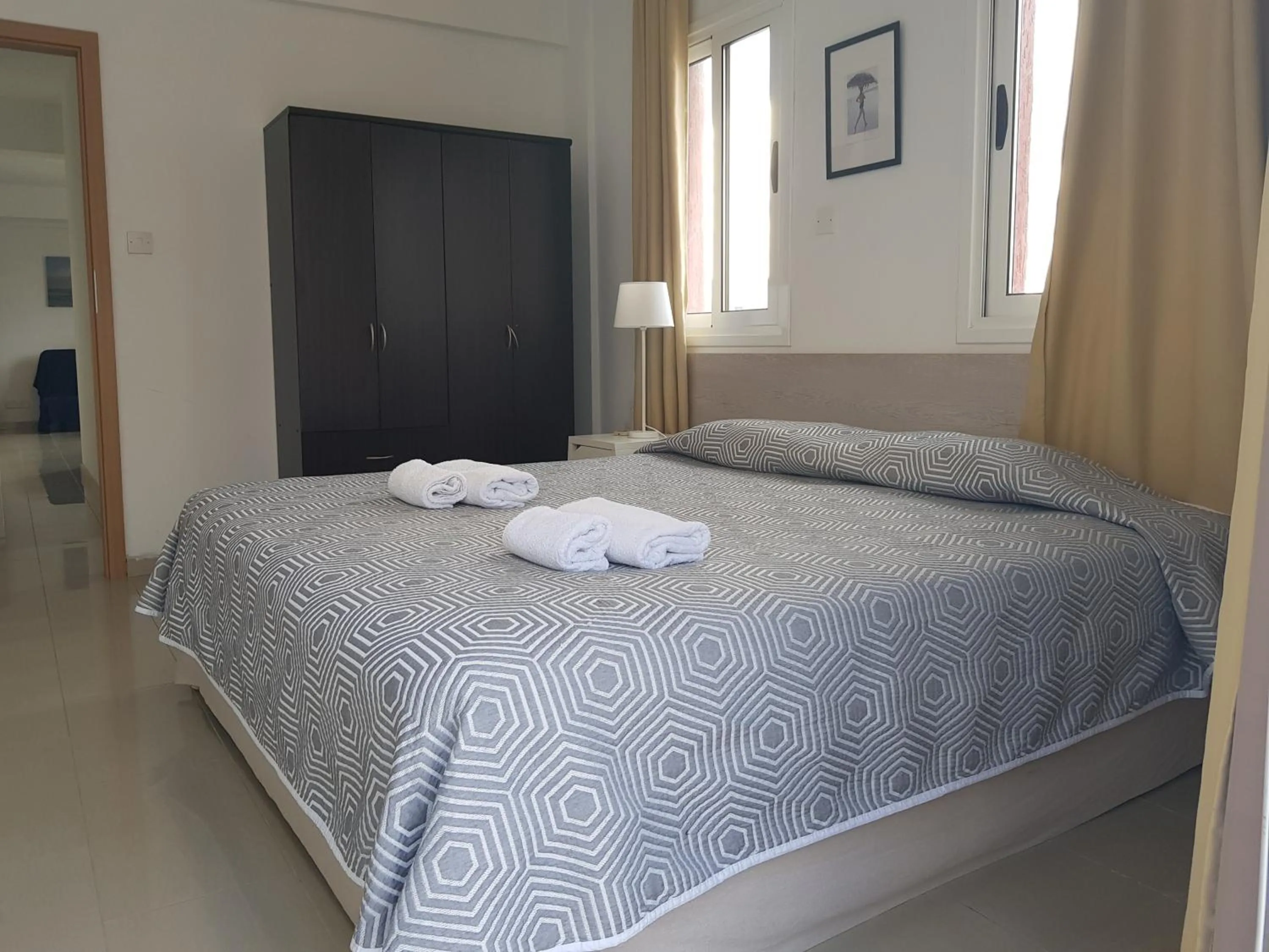 Bed in Valentinos Apartments