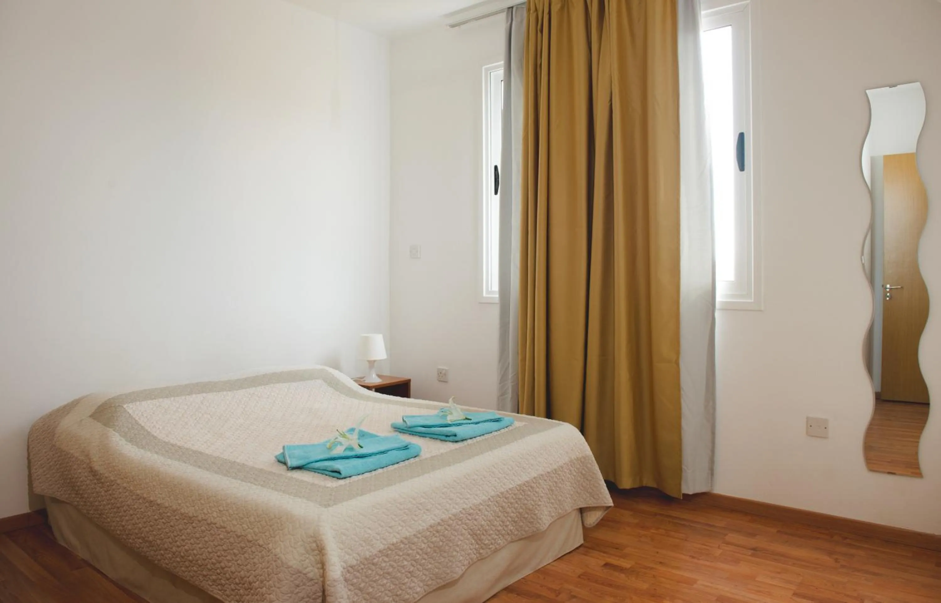 Bed in Valentinos Apartments