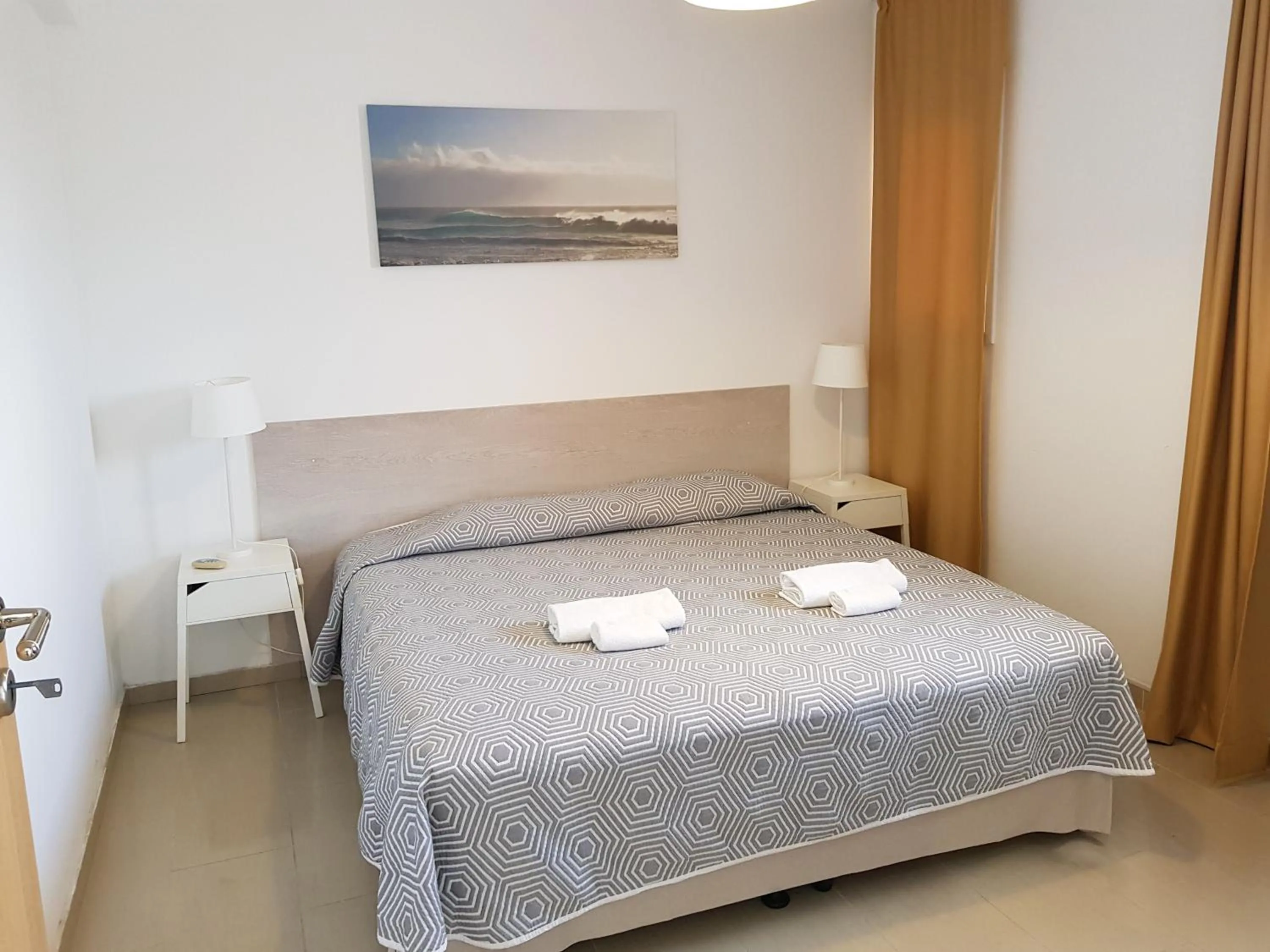 Bed in Valentinos Apartments