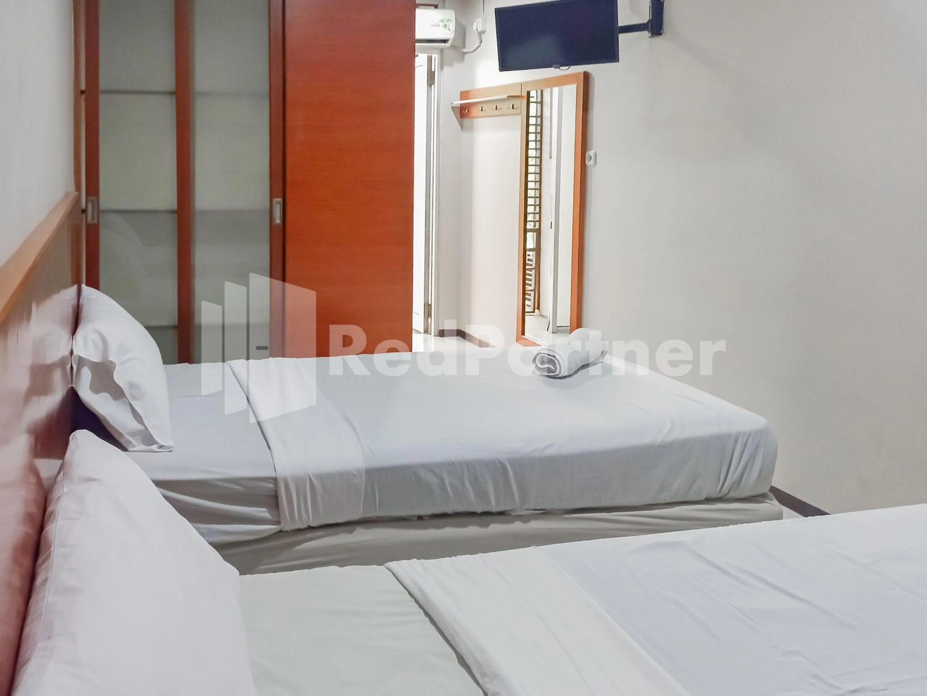 Bedroom in Sang Surya GuestHouse Syariah Near RS Hasan Sadikin Mitra RedDoorz