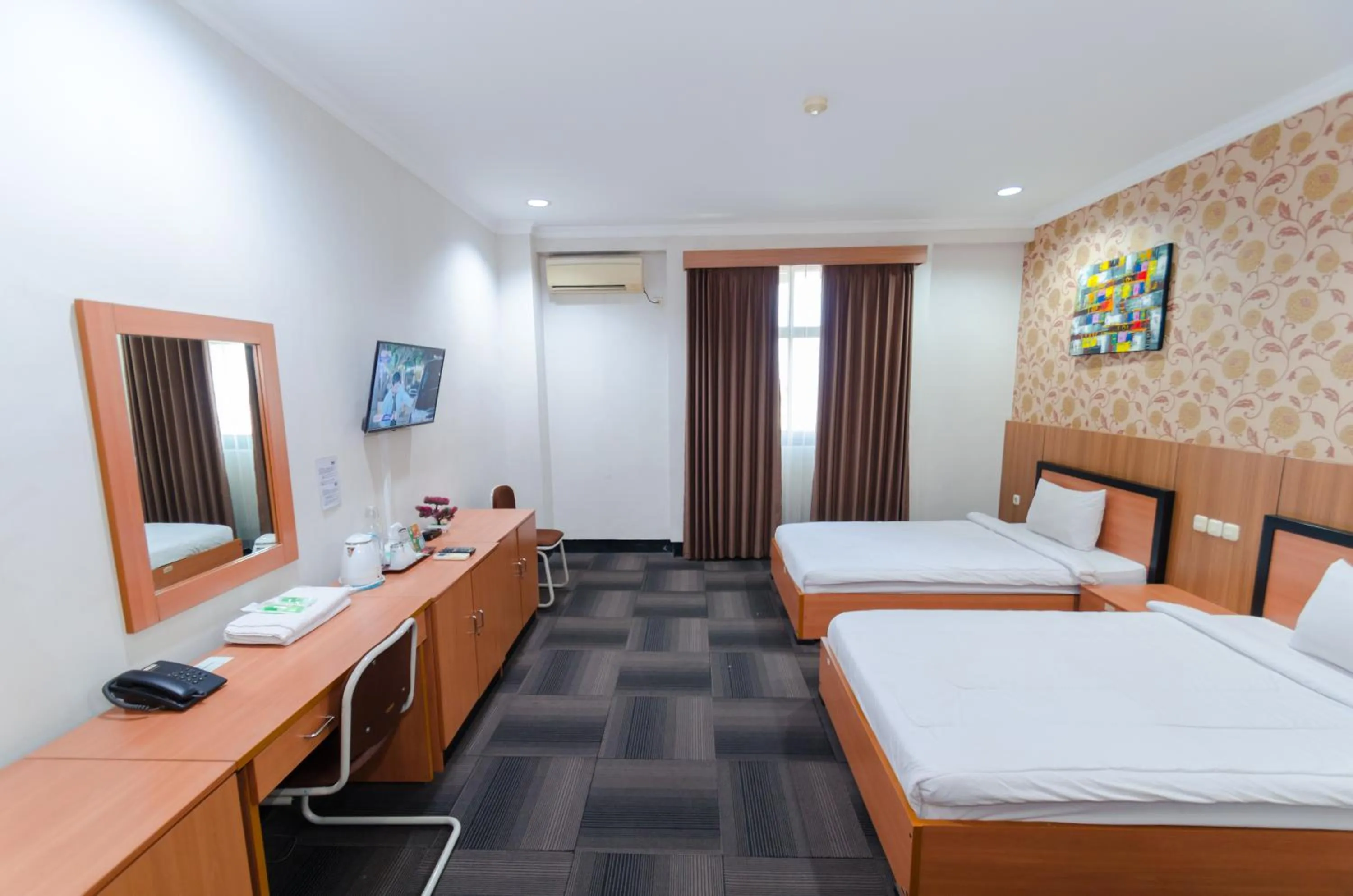 Bed in Graha Widya Bhakti at STIESIA Surabaya