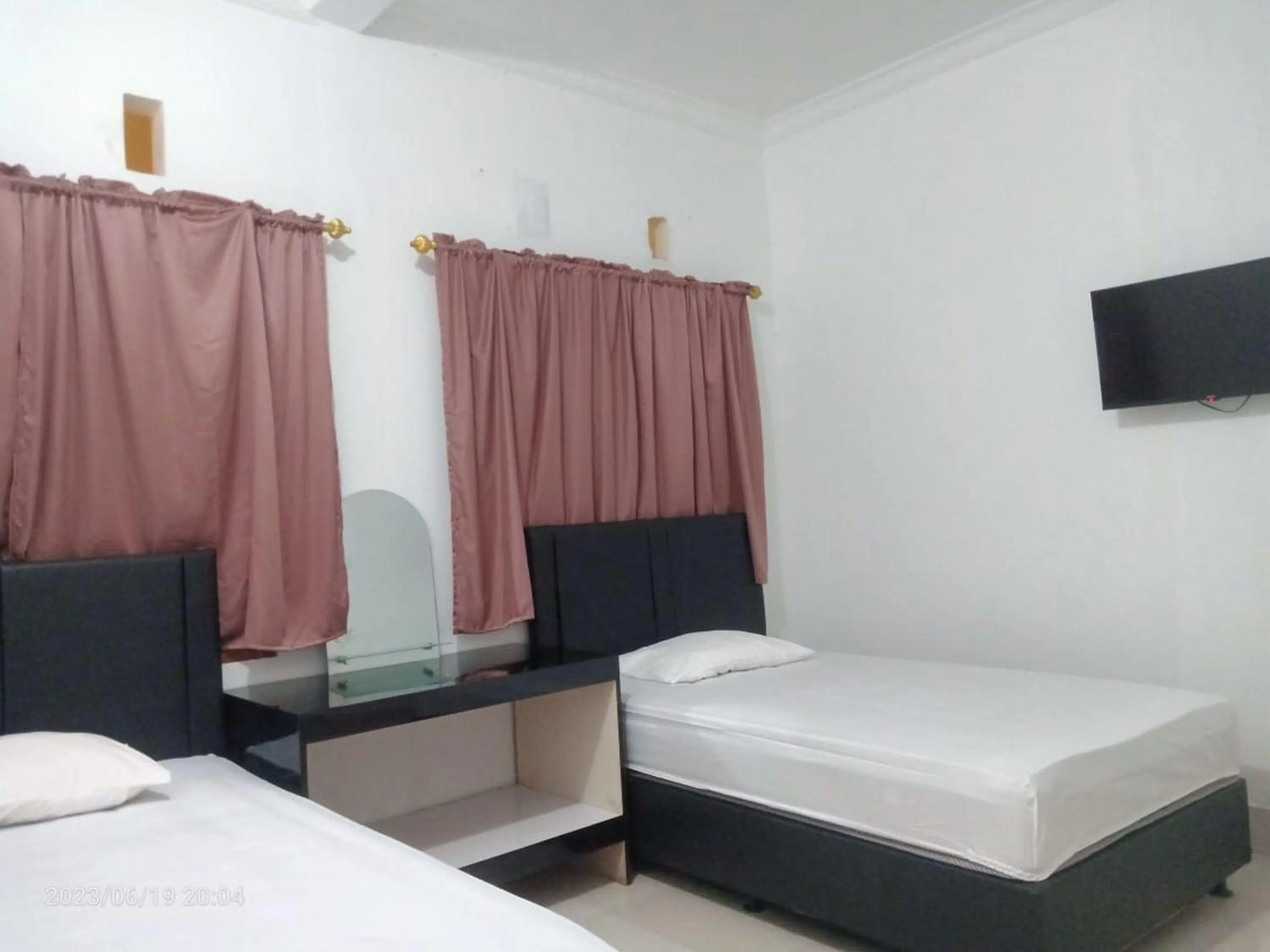 Bedroom in Permata Homestay Kotamobagu Mitra RedDoorz