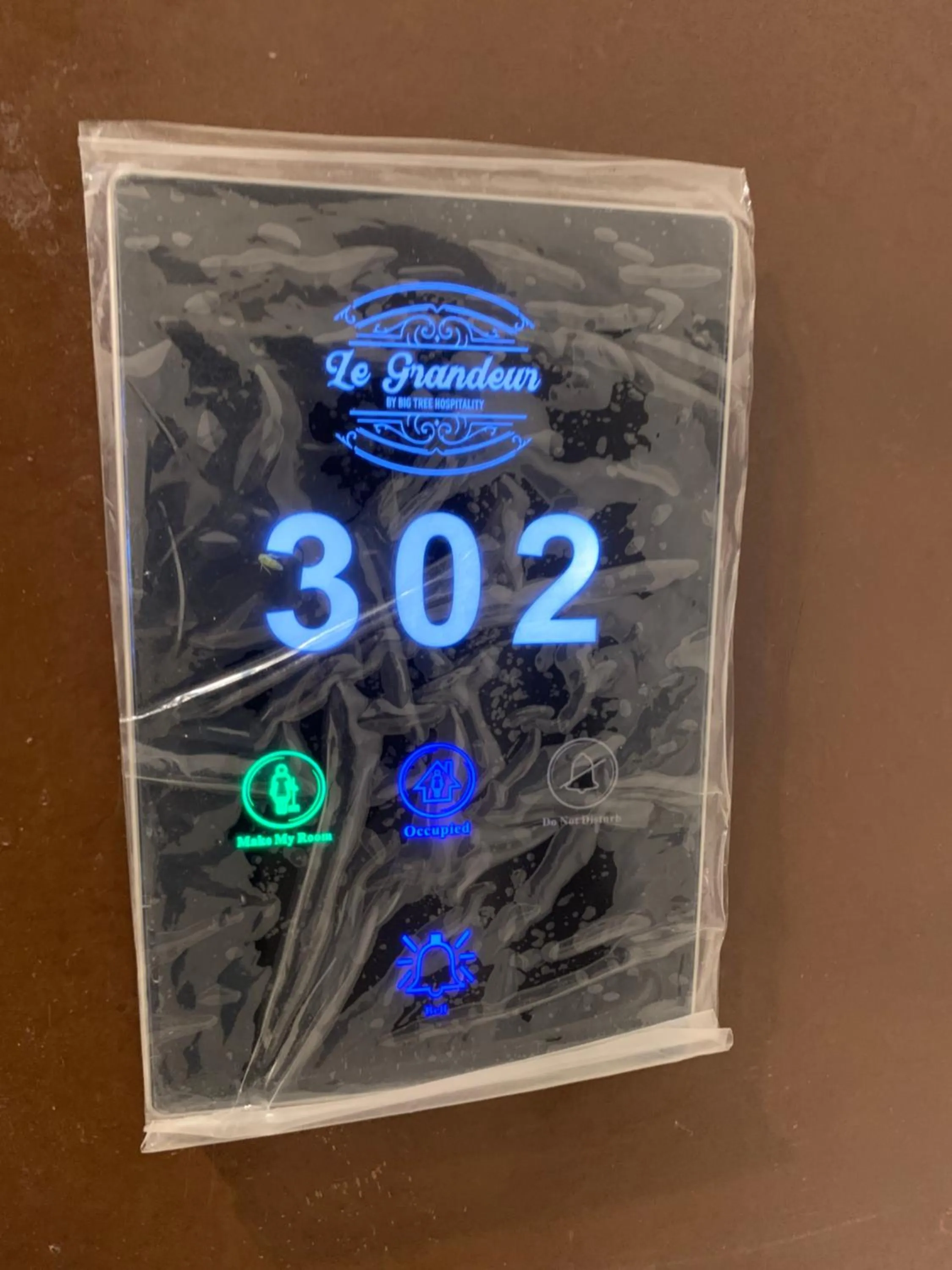 Property logo or sign in Hotel Le Grandeur