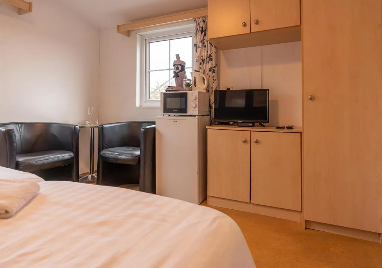 Kitchen or kitchenette, Bed in Chaletparc Krabbenkreek Zeeland - Hotel rooms "Terra Mare"