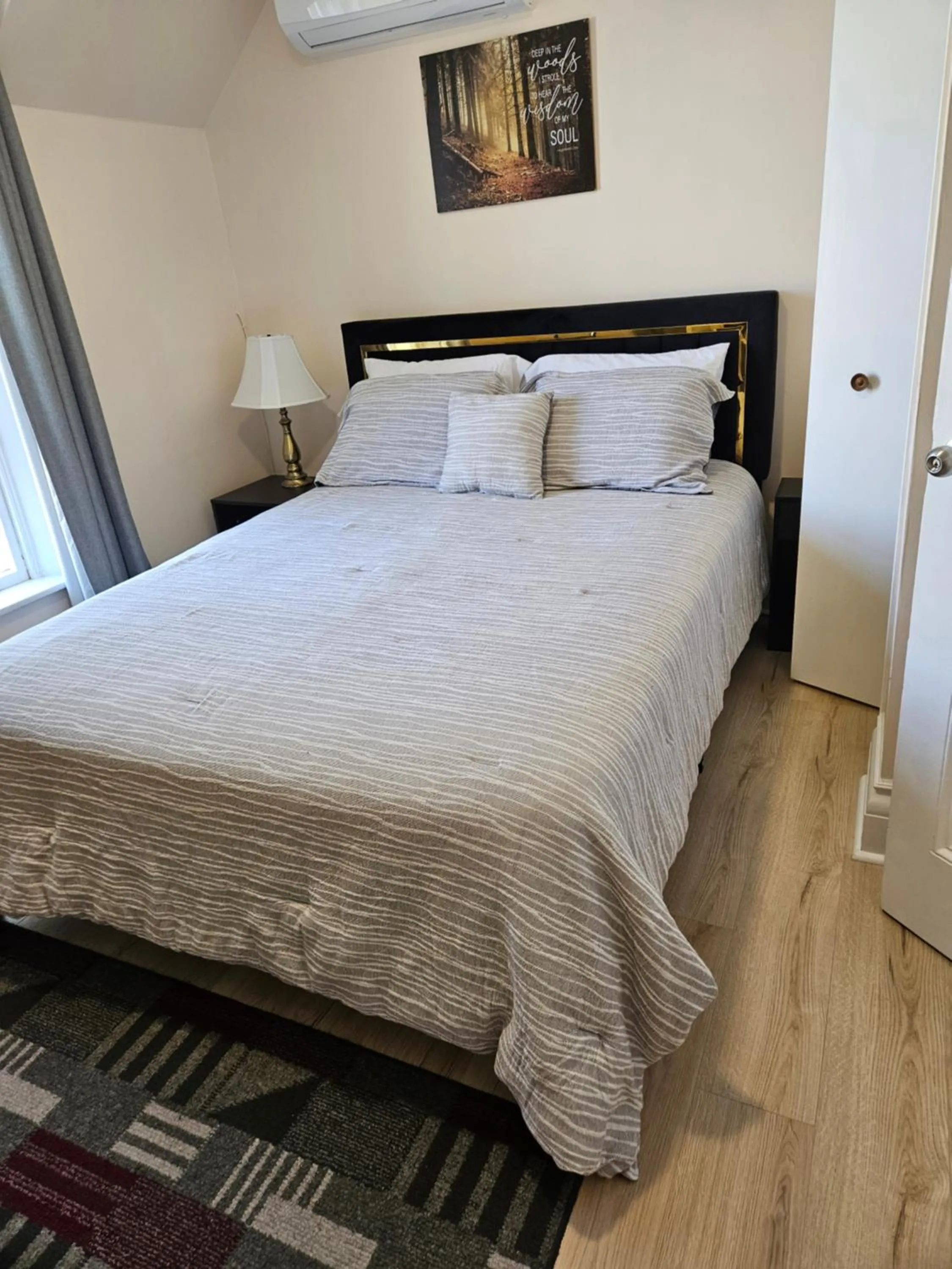 Bed in Sunflower Guest Suites