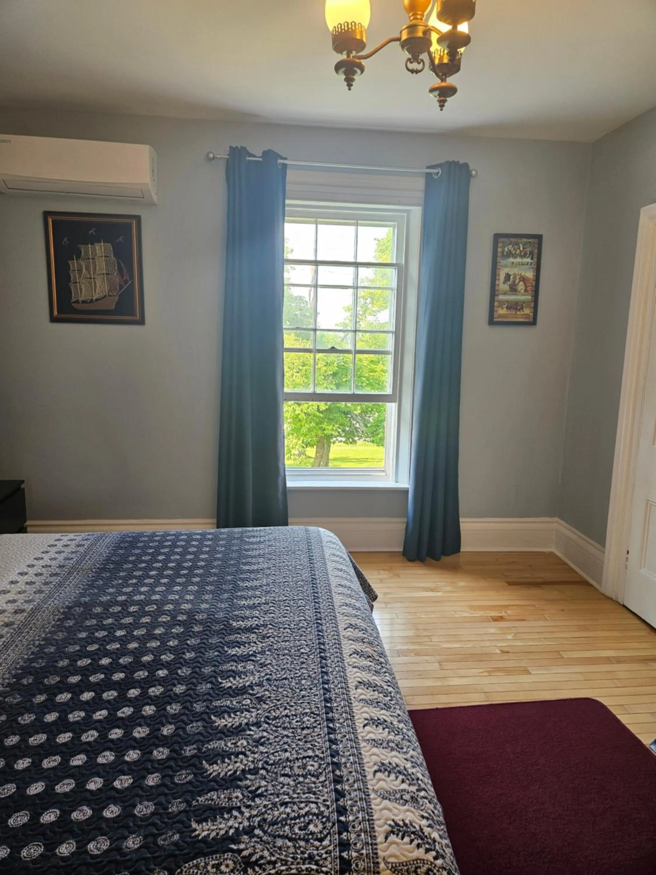 Bed in Sunflower Guest Suites