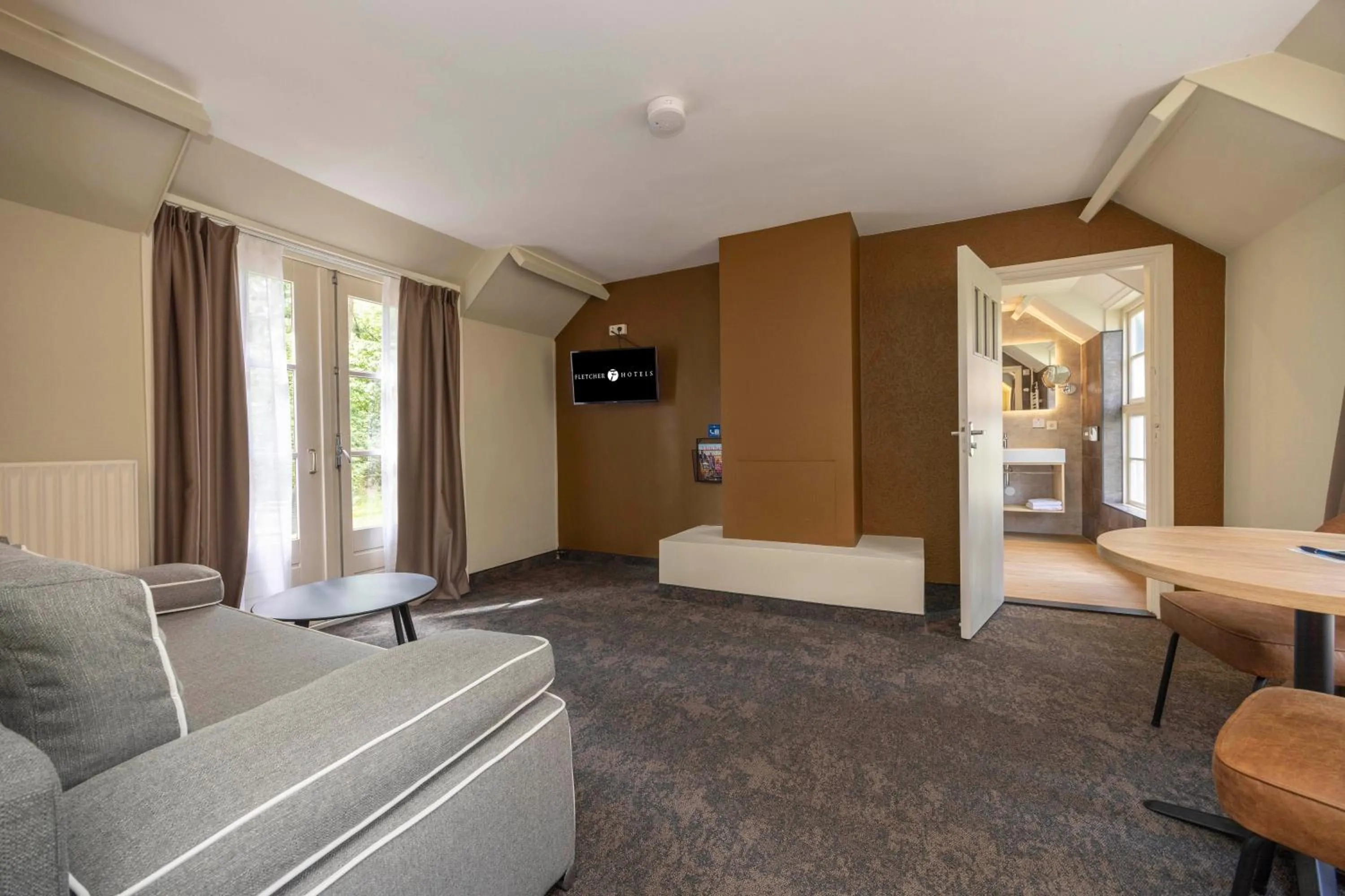 Living room in Fletcher Hotel Restaurant Victoria-Hoenderloo