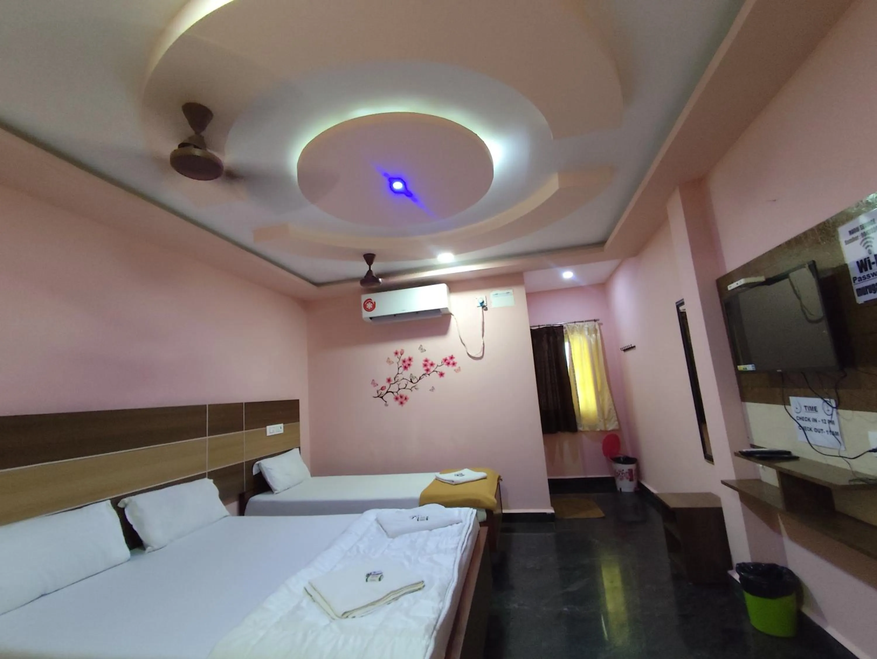 air conditioner, Bed in Sri Murugan Beach Paradise Hotel