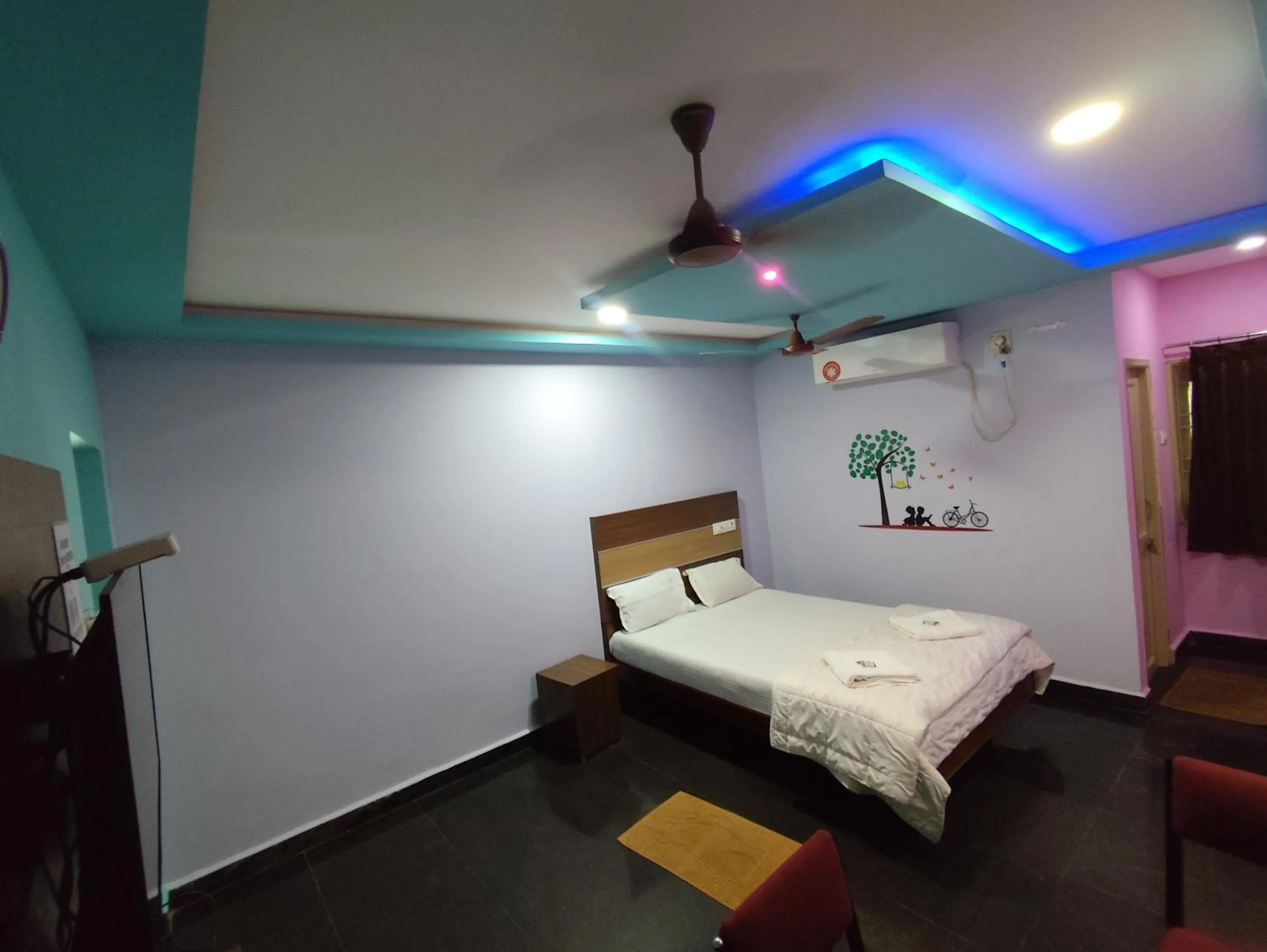 air conditioner, Bed in Sri Murugan Beach Paradise Hotel