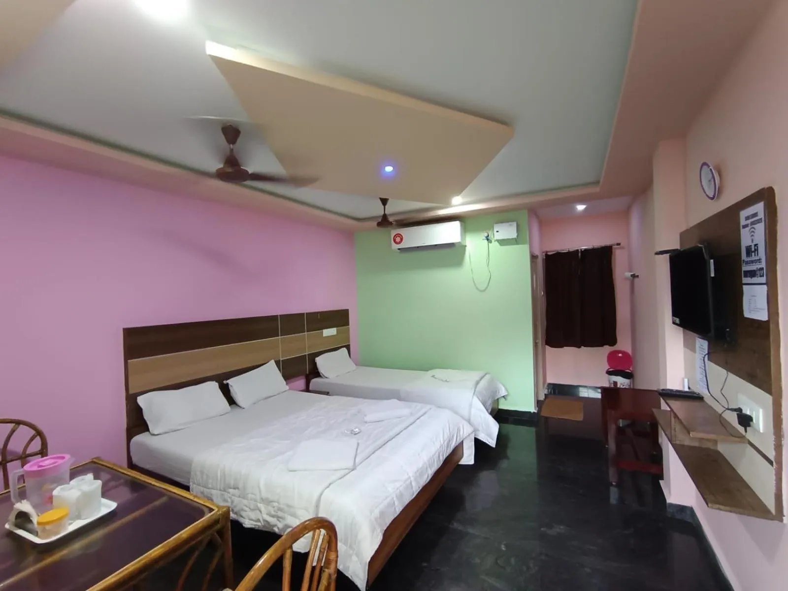 Communal lounge/ TV room, Bed in Sri Murugan Beach Paradise Hotel