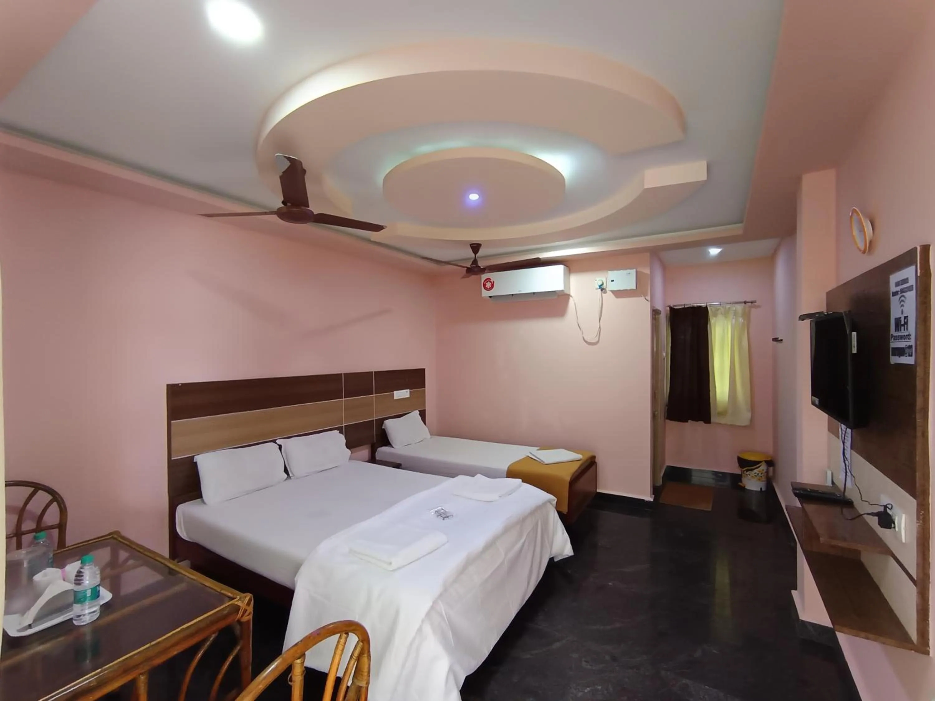 Photo of the whole room, Bed in Sri Murugan Beach Paradise Hotel