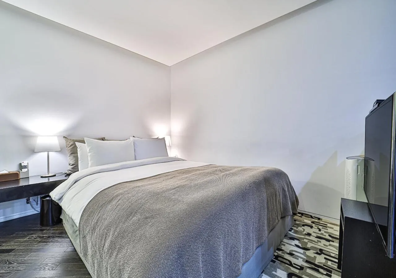 Bed in JS Boutique Hotel