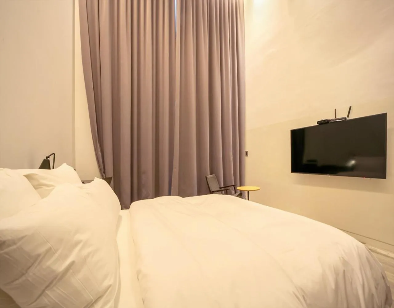 Bed in JS Boutique Hotel