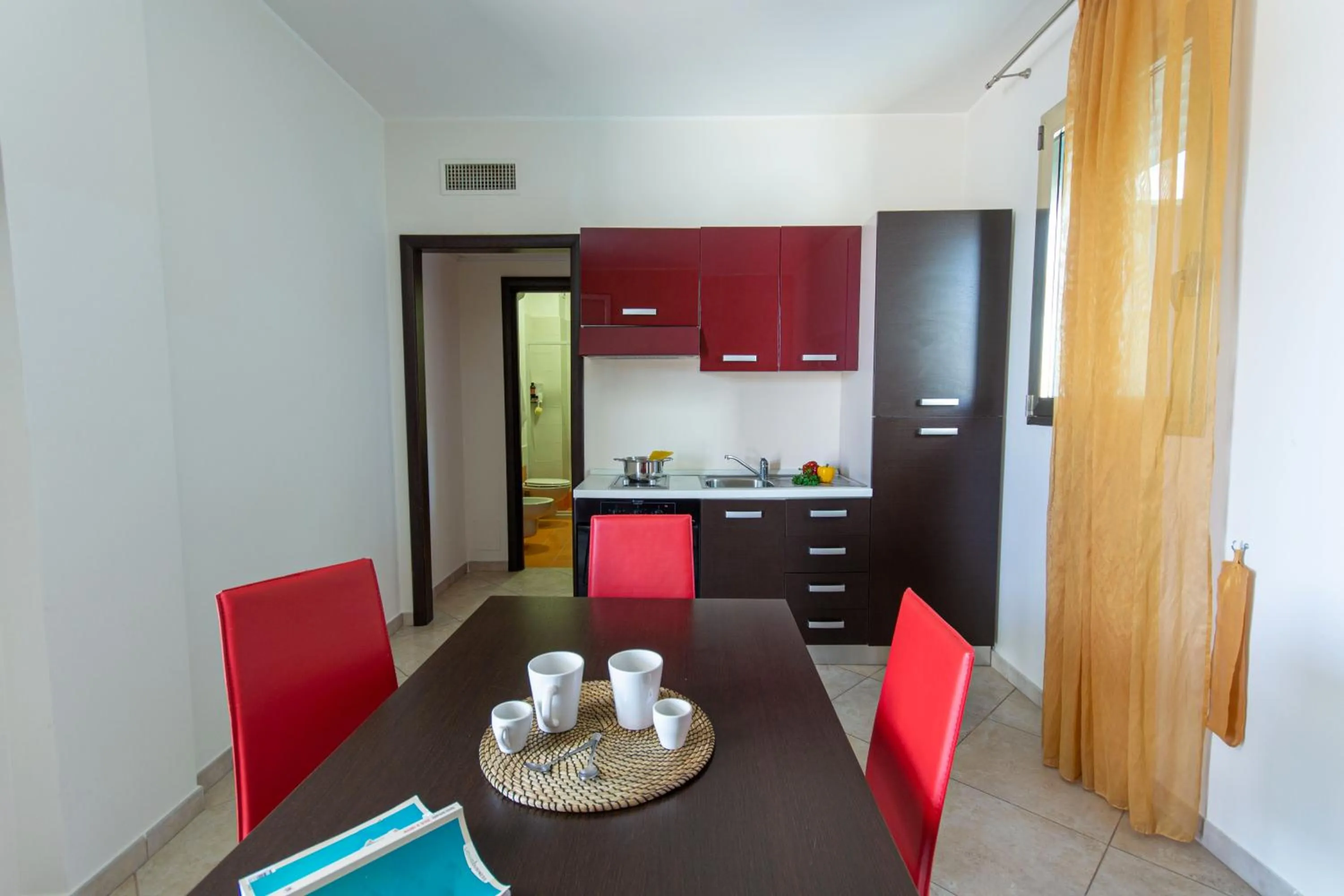 Kitchen or kitchenette in Residence Borgo & Mare - Localo