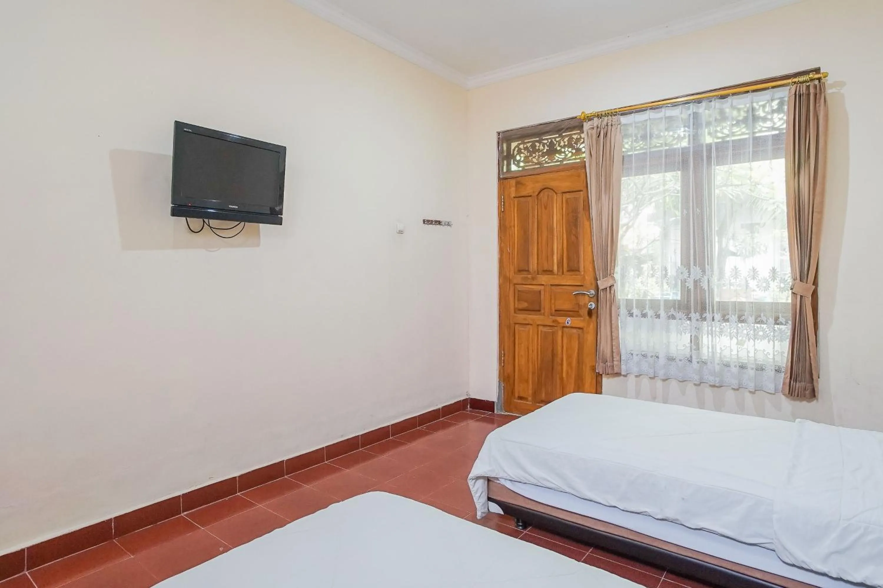 Photo of the whole room, Bed in Mahendra Beach Inn