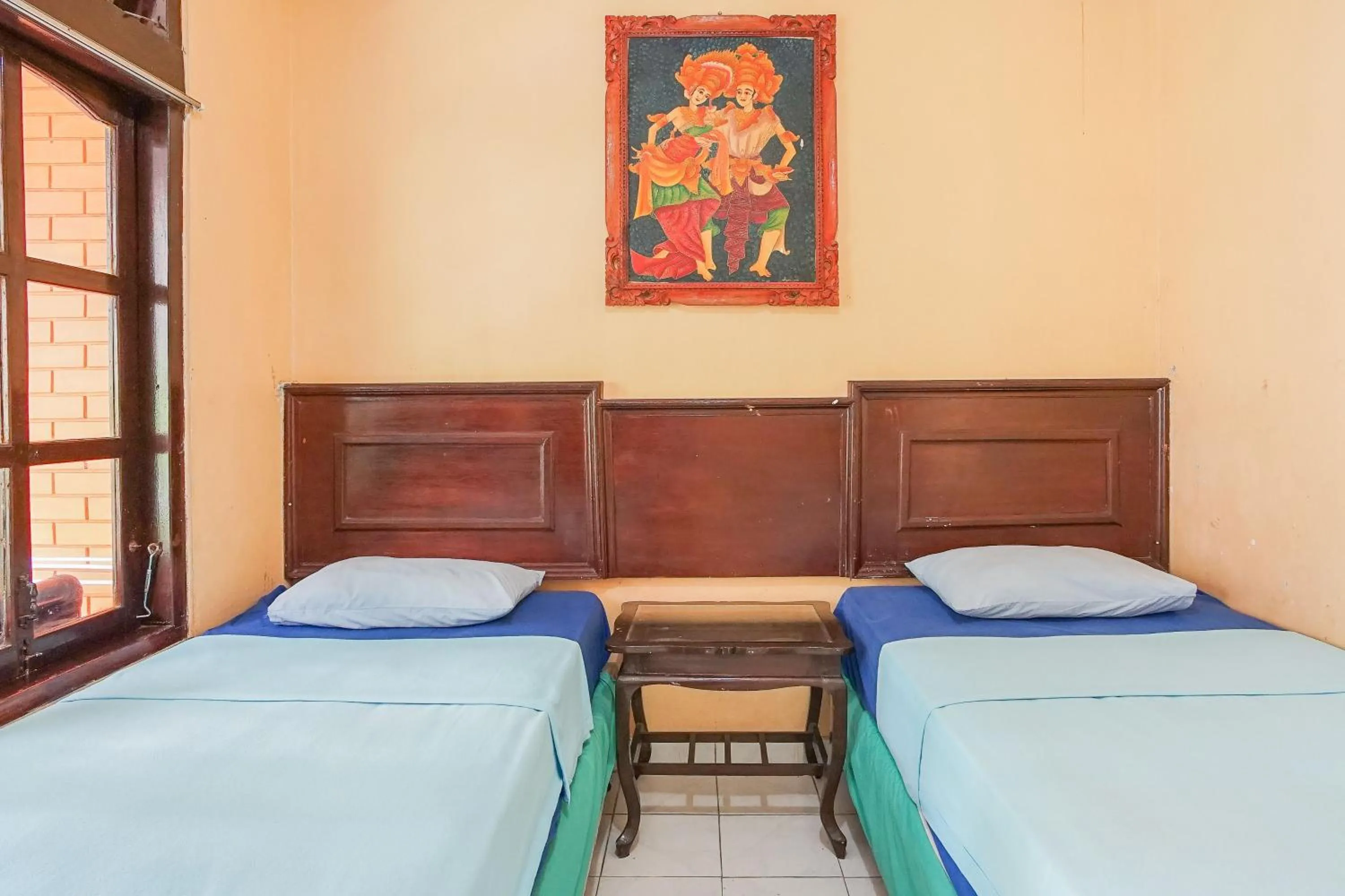 Bed in Mahendra Beach Inn