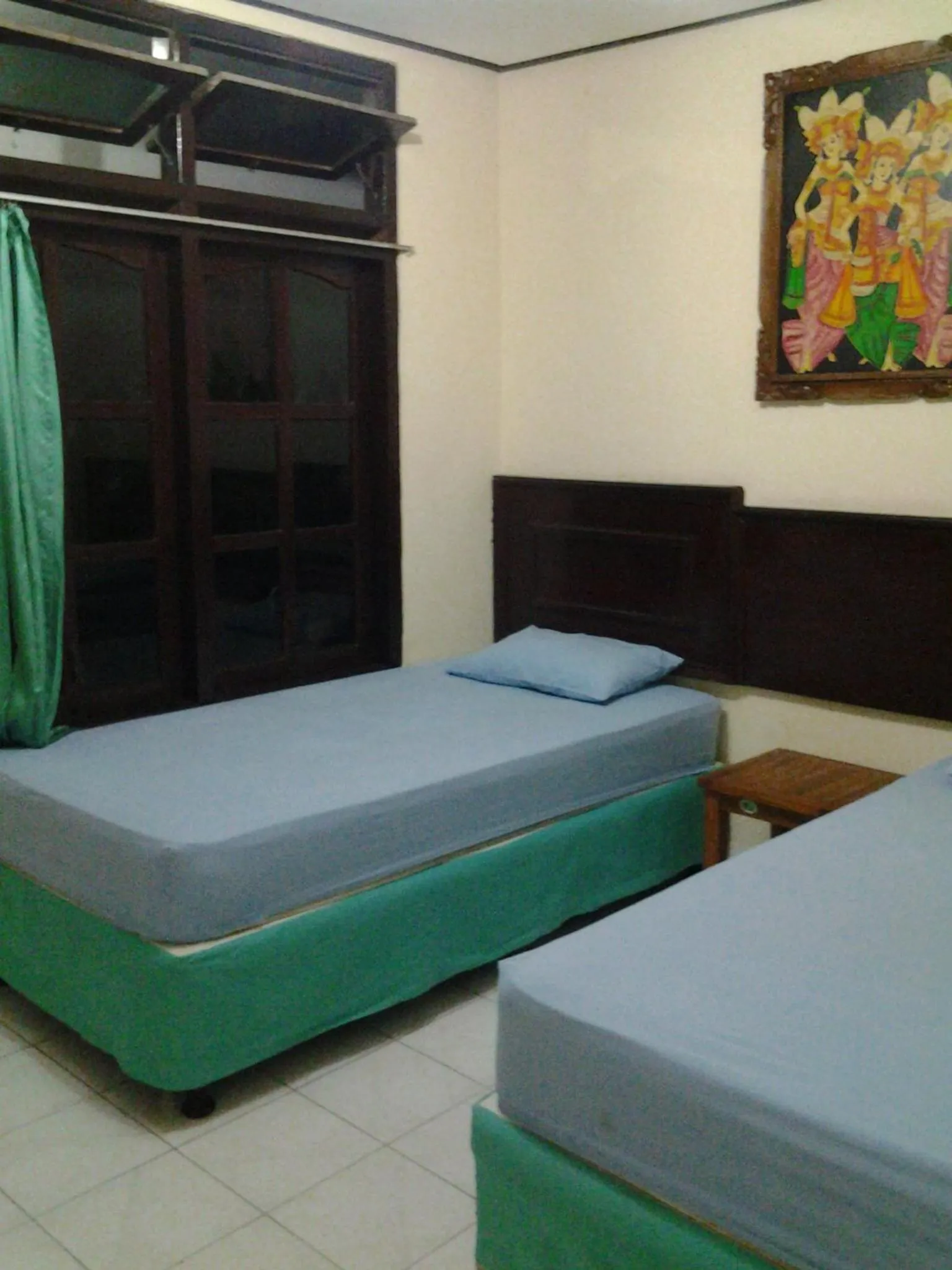 Bed in Mahendra Beach Inn
