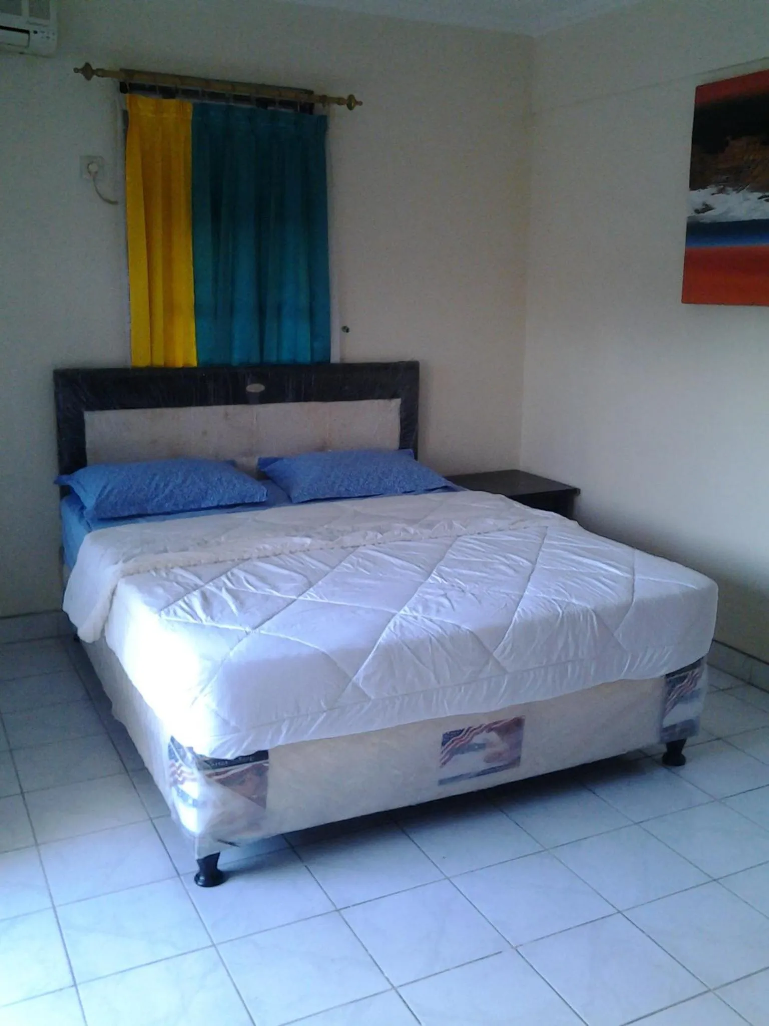 Bed in Mahendra Beach Inn