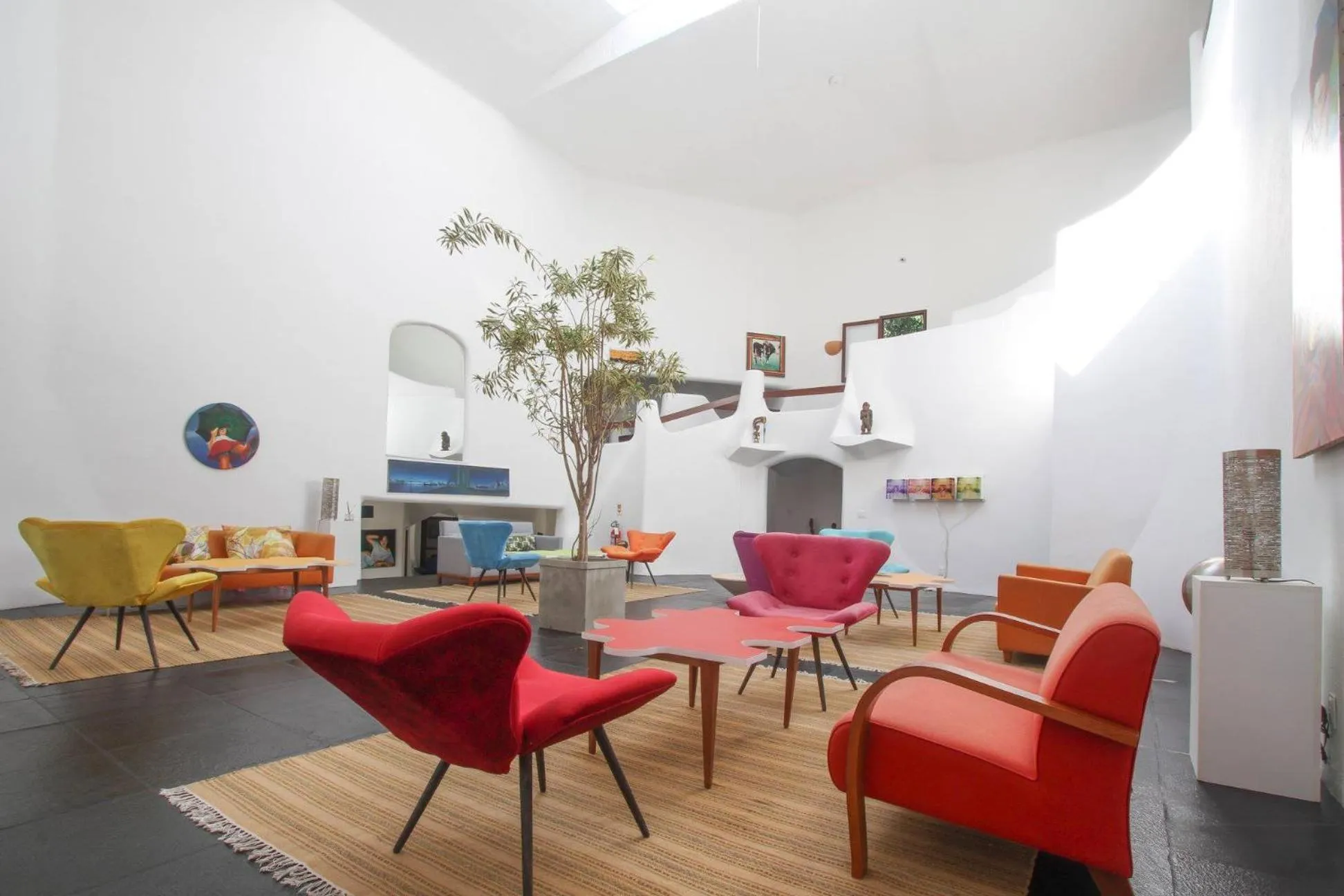 Communal lounge/ TV room in Les Jardins de Rio Boutique Hotel