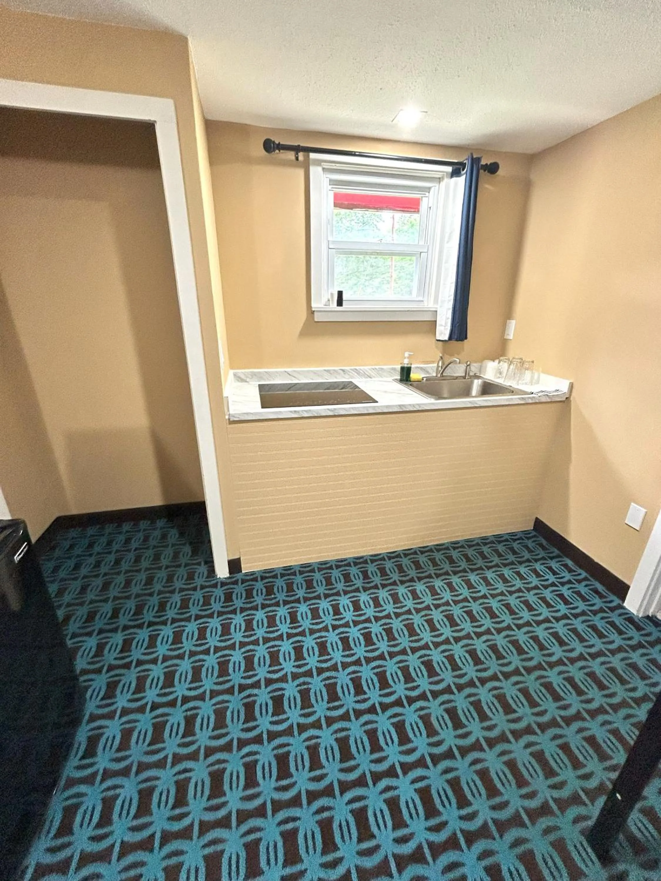 kitchen in The Villager Motel