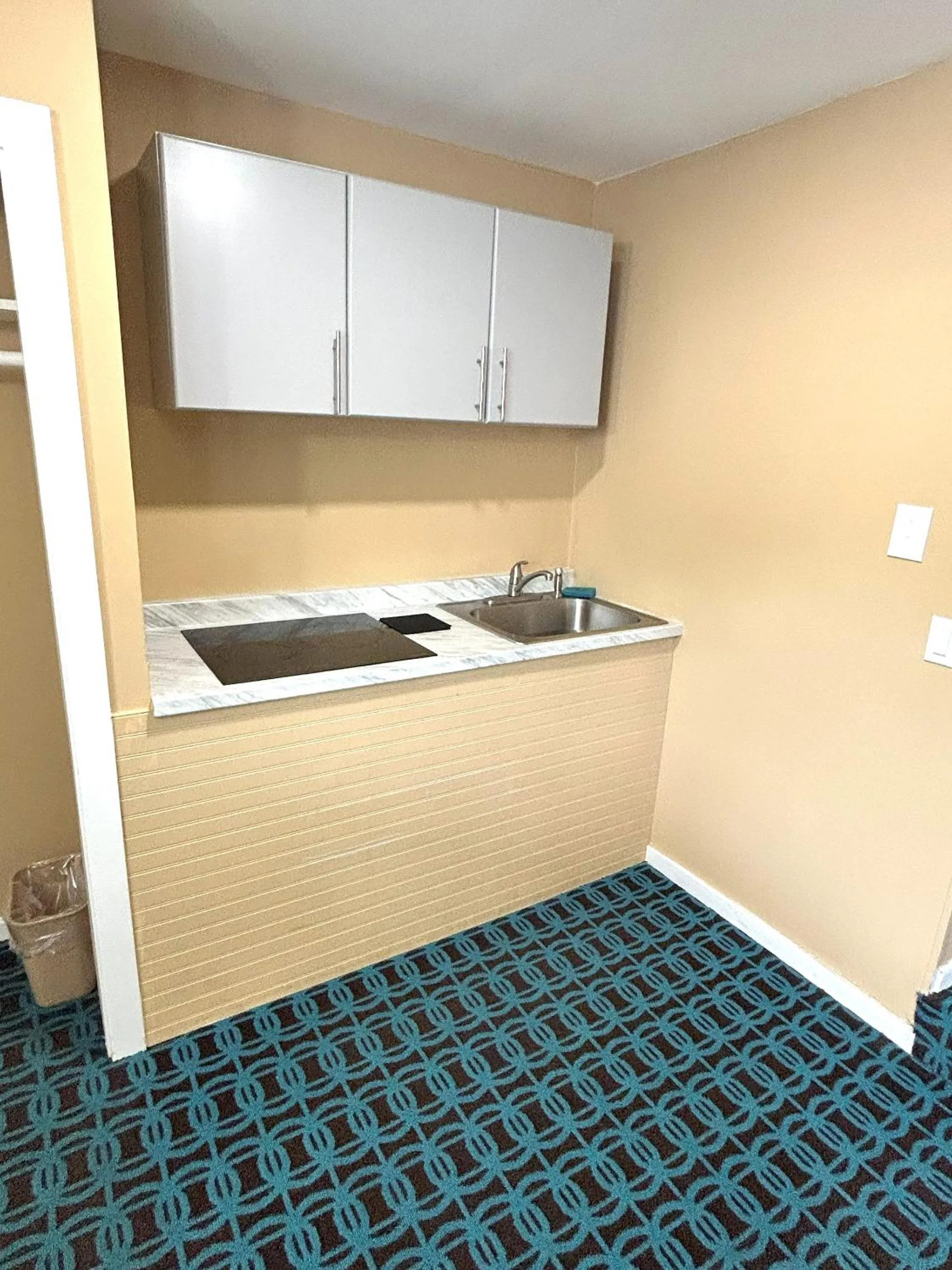 kitchen in The Villager Motel