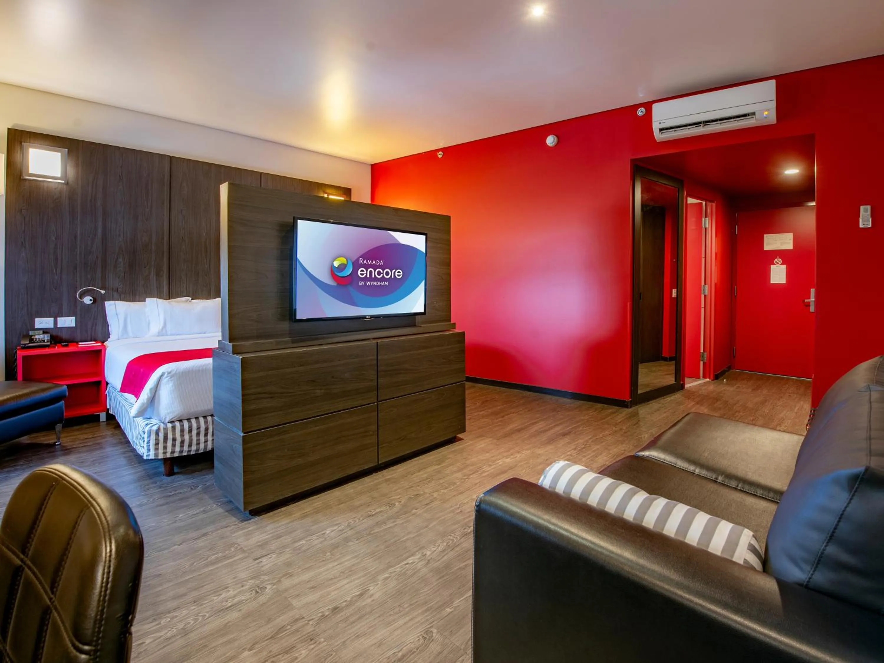 Bedroom in Ramada Encore by Wyndham Queretaro