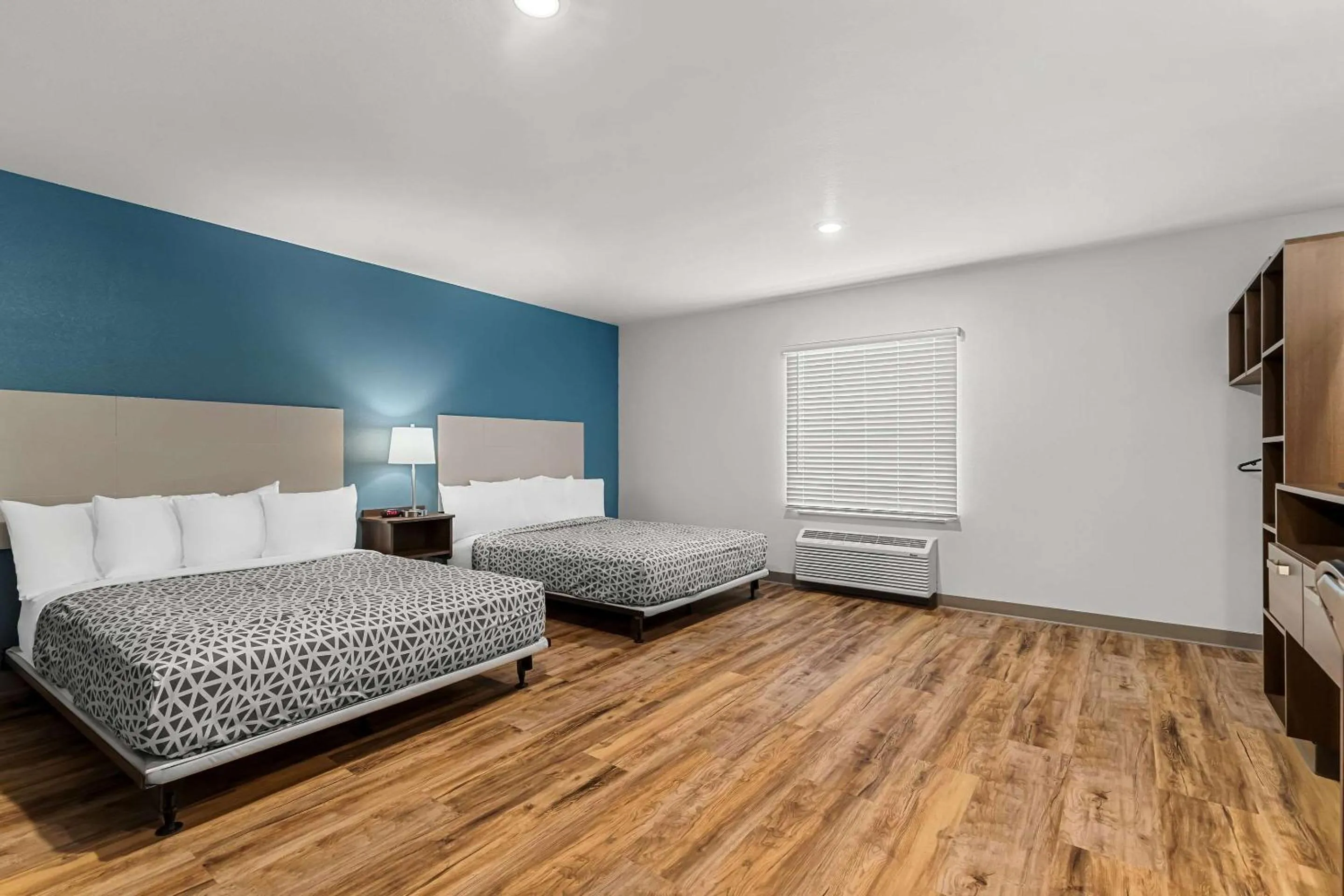 Bedroom, Bed in WoodSpring Suites Corona