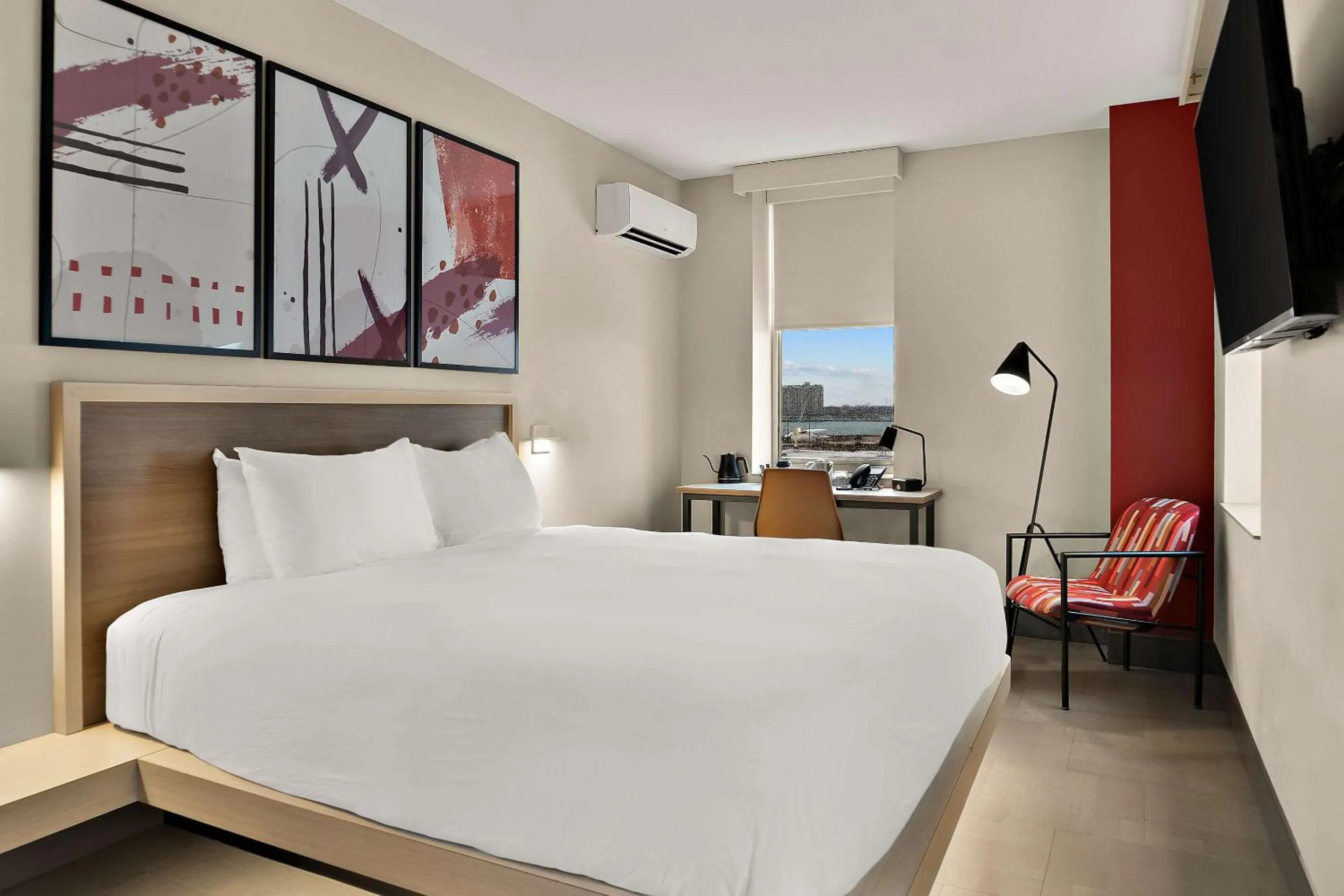 Bedroom in CityFlatsHotel - Port Huron, an Ascend Collection Hotel