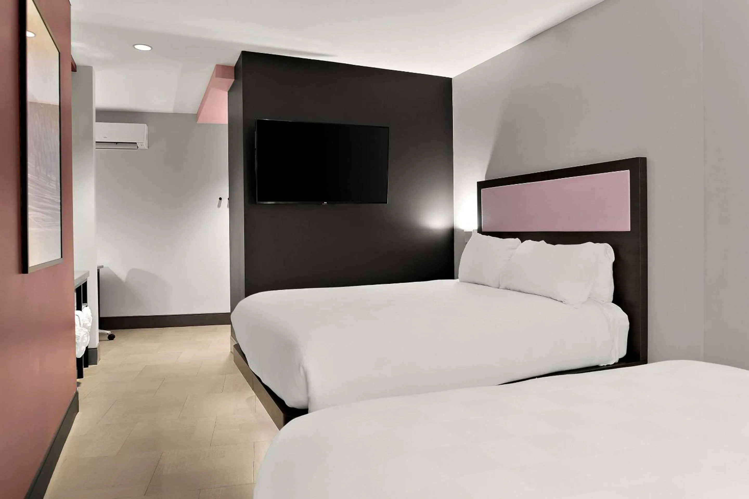 Bedroom in CityFlatsHotel - Port Huron, an Ascend Collection Hotel
