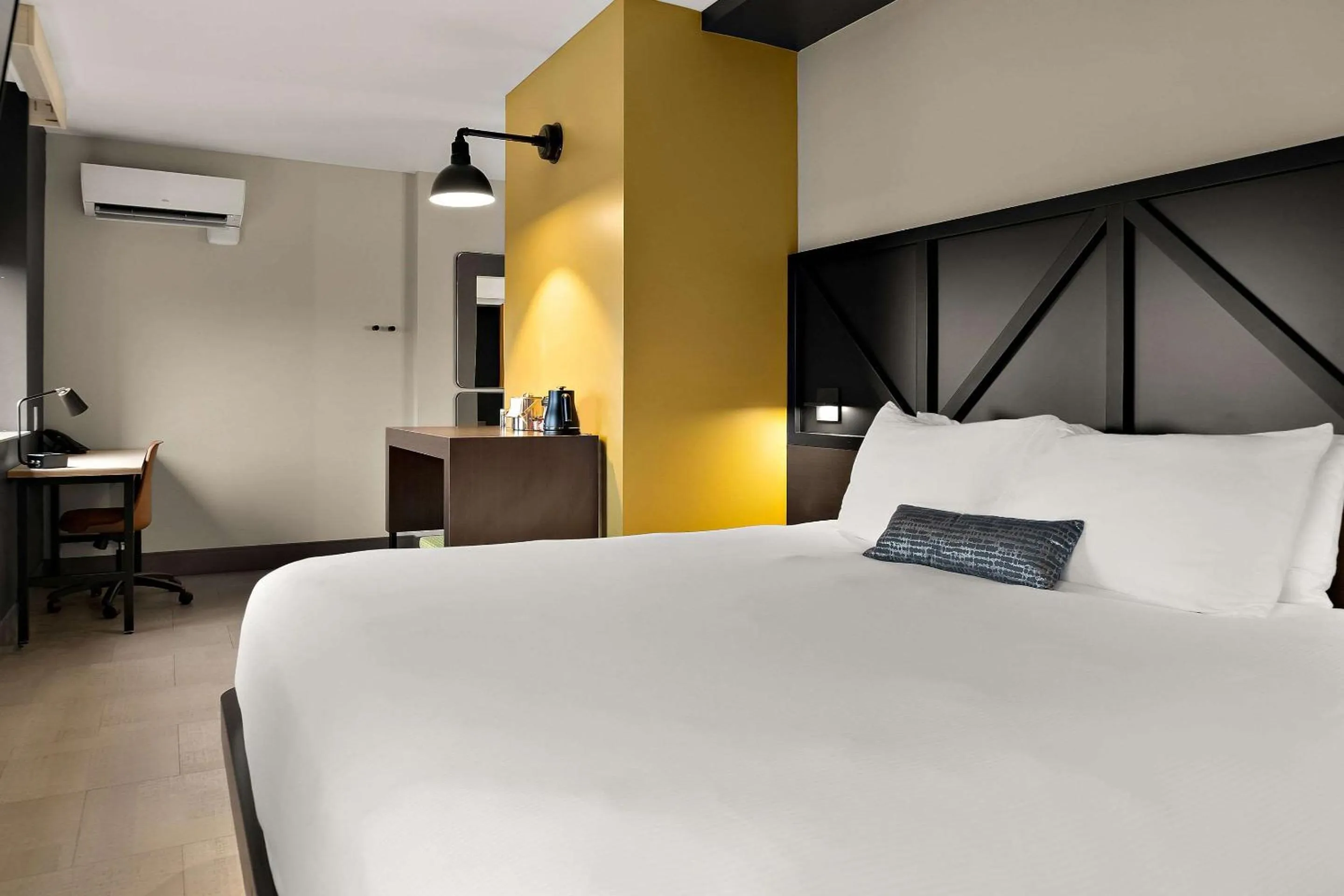 Bedroom in CityFlatsHotel - Port Huron, an Ascend Collection Hotel