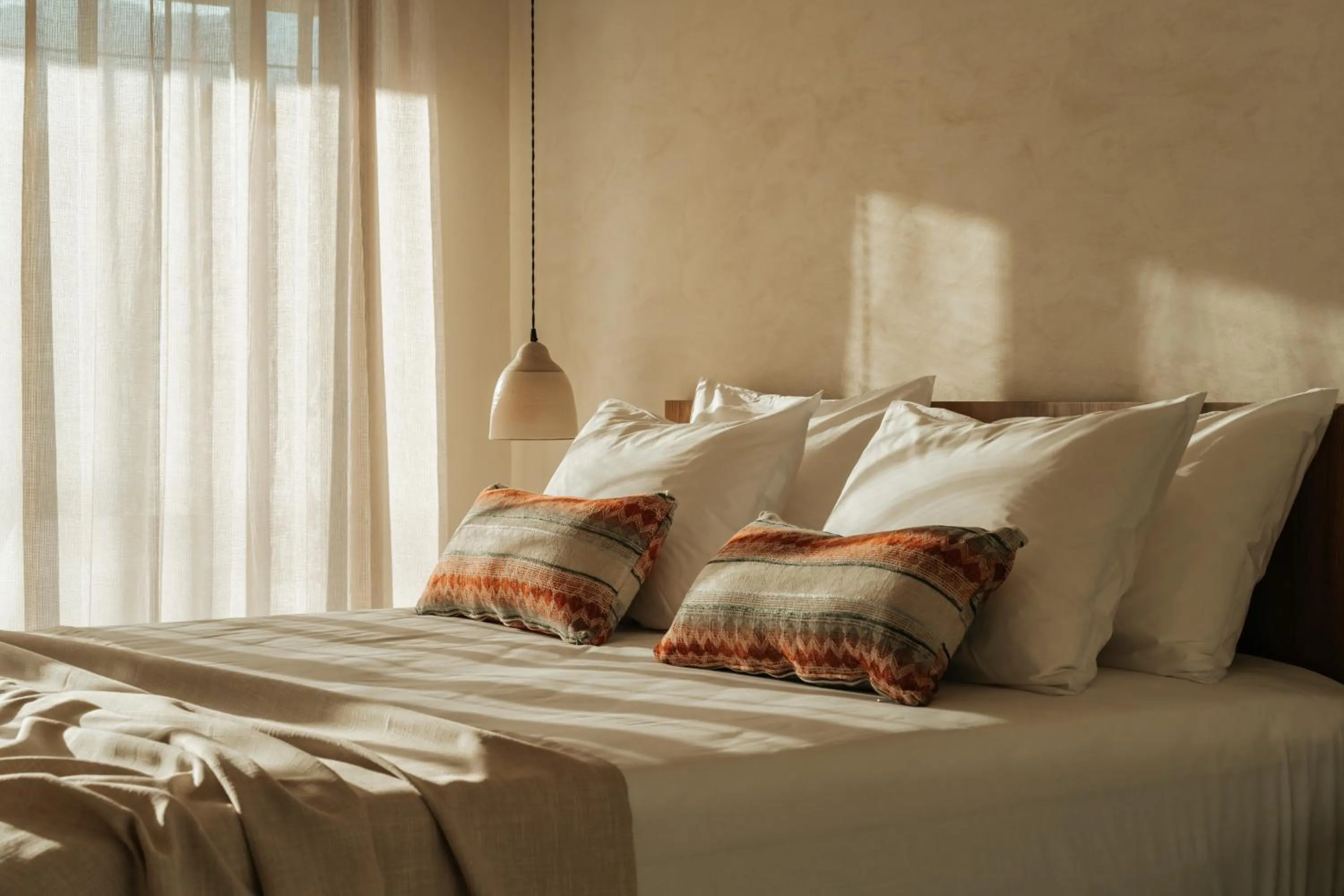 Bed in AMÉNTE Mindful Stay