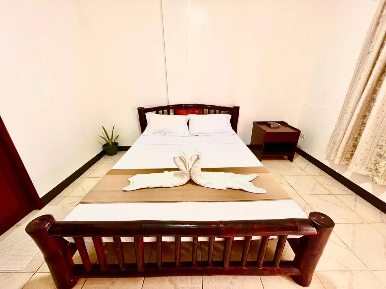 Bed in CHIISAI NATSU RESORT