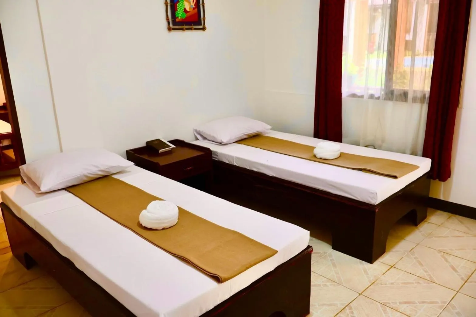 Bed in CHIISAI NATSU RESORT