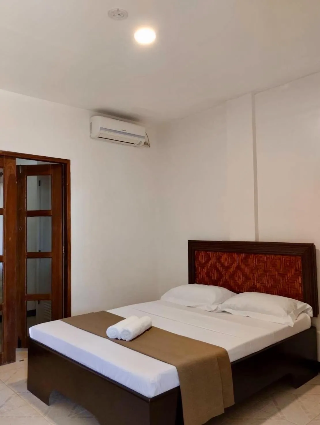 Bed in CHIISAI NATSU RESORT