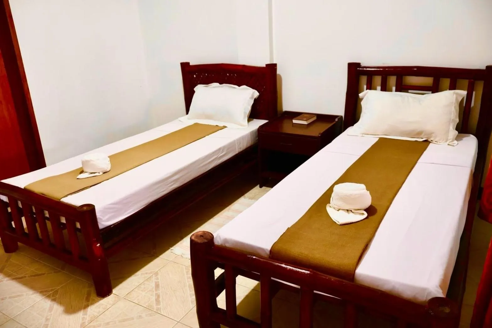 Bed in CHIISAI NATSU RESORT