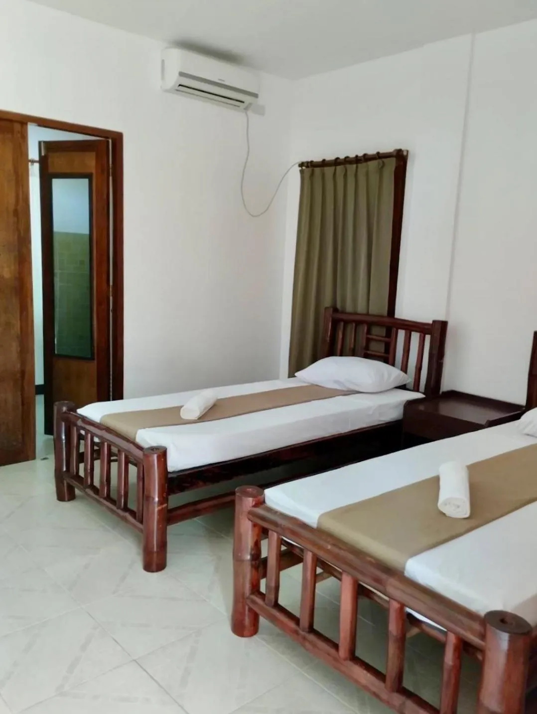 Bed in CHIISAI NATSU RESORT