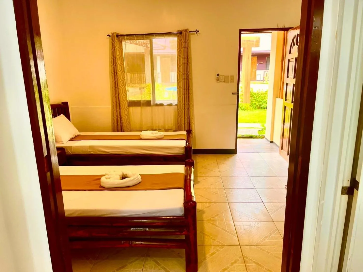 Bed in CHIISAI NATSU RESORT