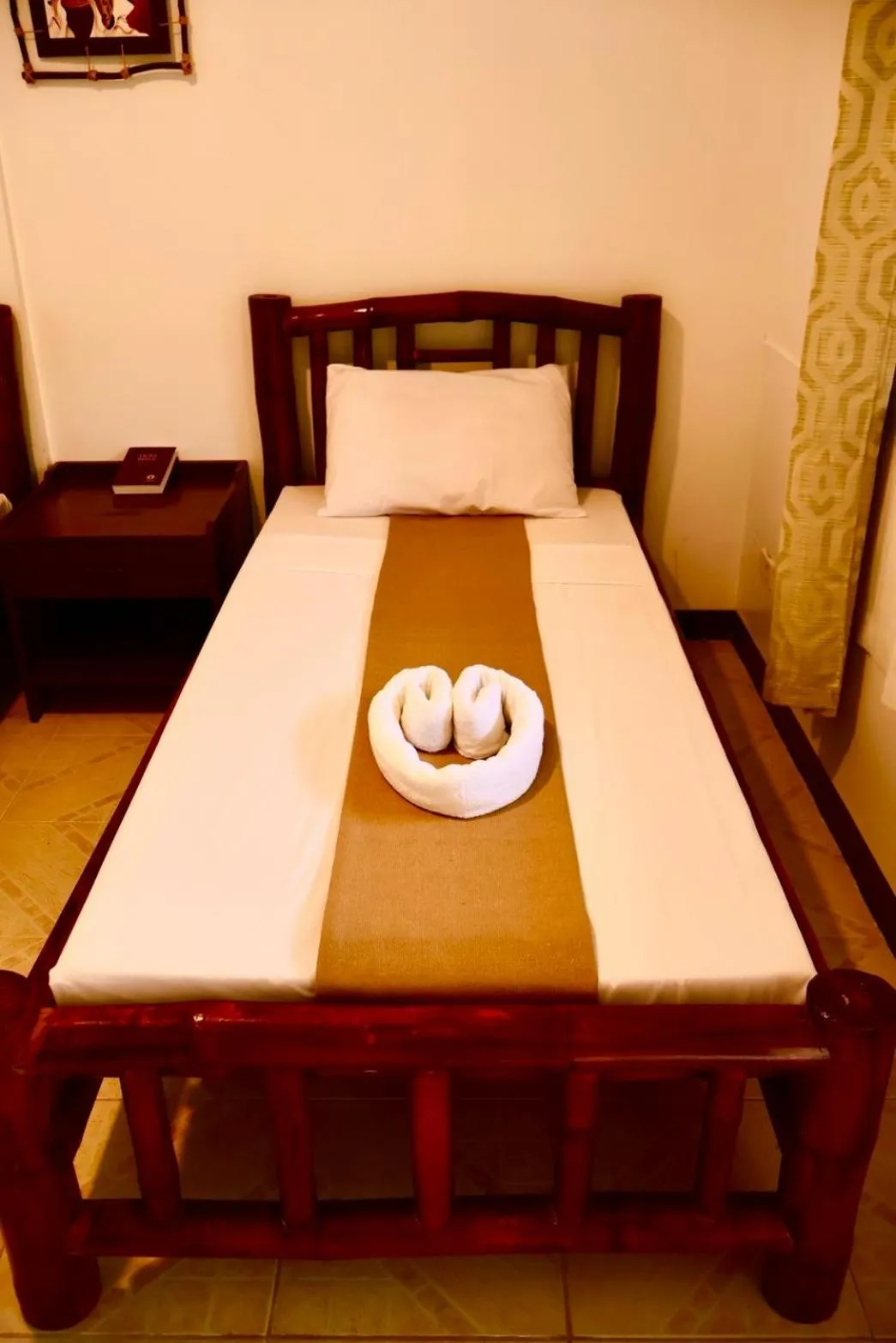 Bed in CHIISAI NATSU RESORT