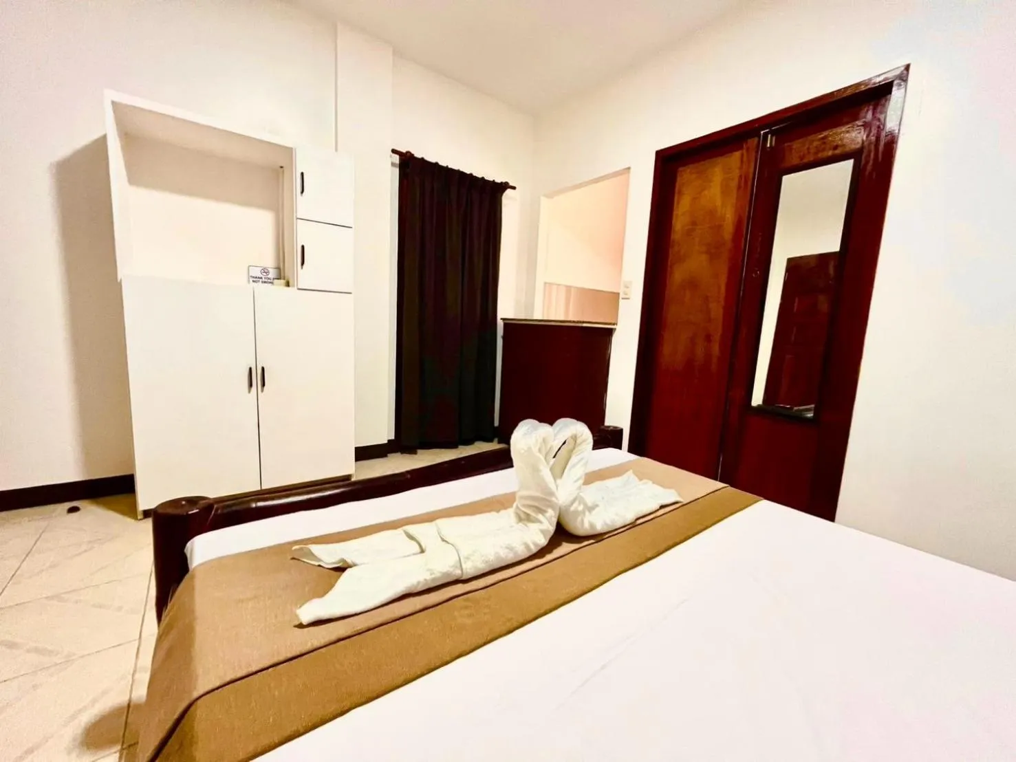 Bed in CHIISAI NATSU RESORT